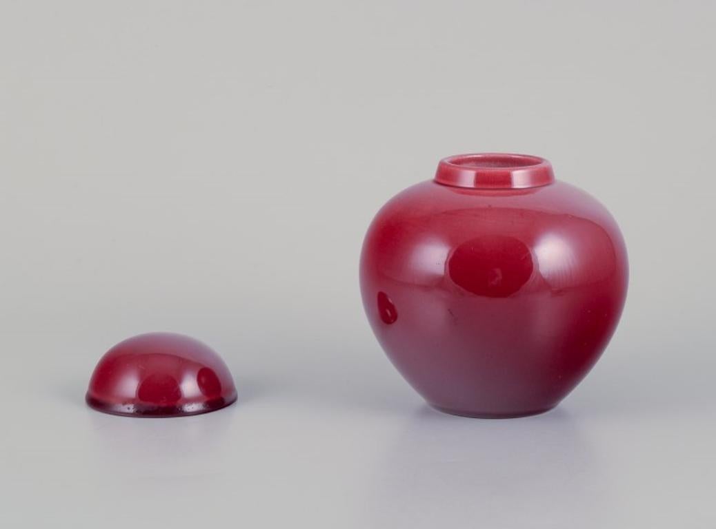 Paul Millet for Sevres, France. Unique lidded ceramic jar with oxblood glaze.
Ca. 1940.
Marked.
In excellent condition.
Dimensions: Height 13.0 cm x Diameter 11.0 cm.