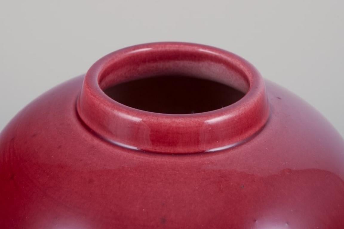 Glazed Paul Millet for Sevres, France. Unique lidded ceramic jar with oxblood glaze.  For Sale