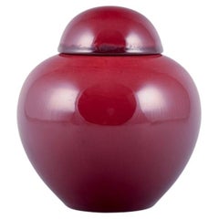 Paul Millet for Sevres, France. Unique lidded ceramic jar with oxblood glaze. 