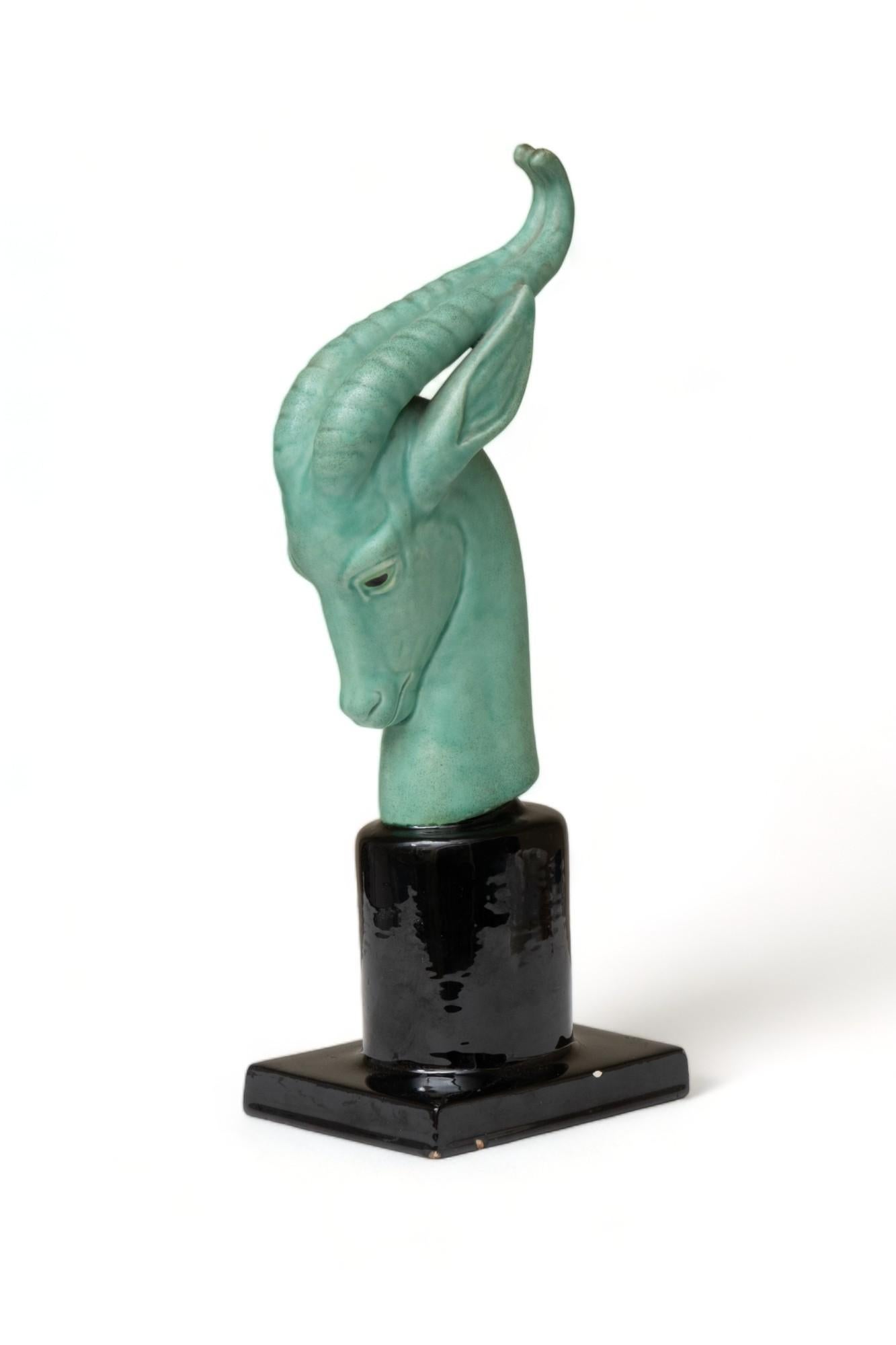 Sevres Green glazed ceramic antelope head mounted on a ceramic pedestal