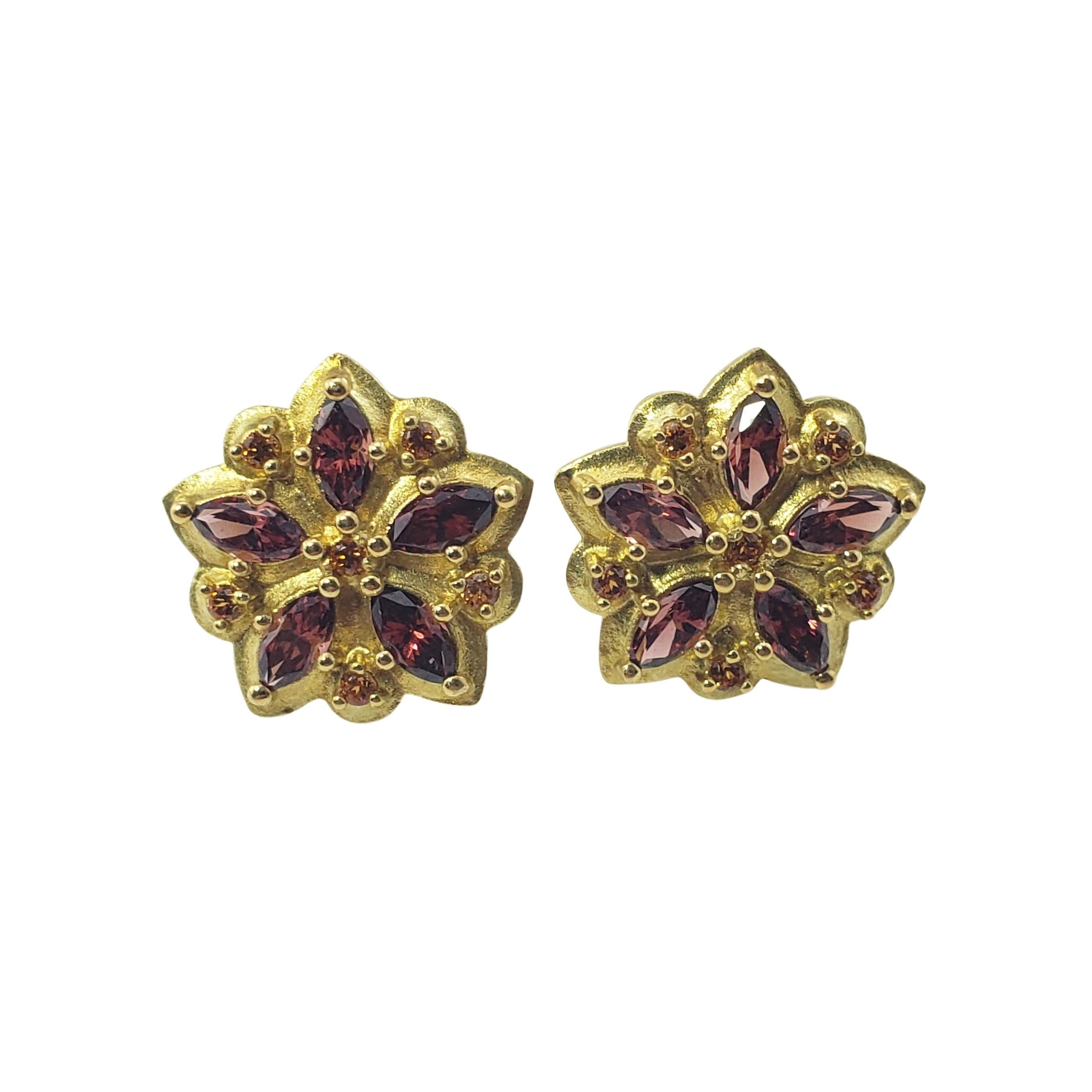 Paul Morelli 18 Karat Yellow Gold Garnet and Citrine Flower Earrings-

These stunning flower earrings by New York jewelry designer Paul Morelli each feature five marquis garnets (6 mm x 3 mm each) and five citrine gemstones set in beautifully