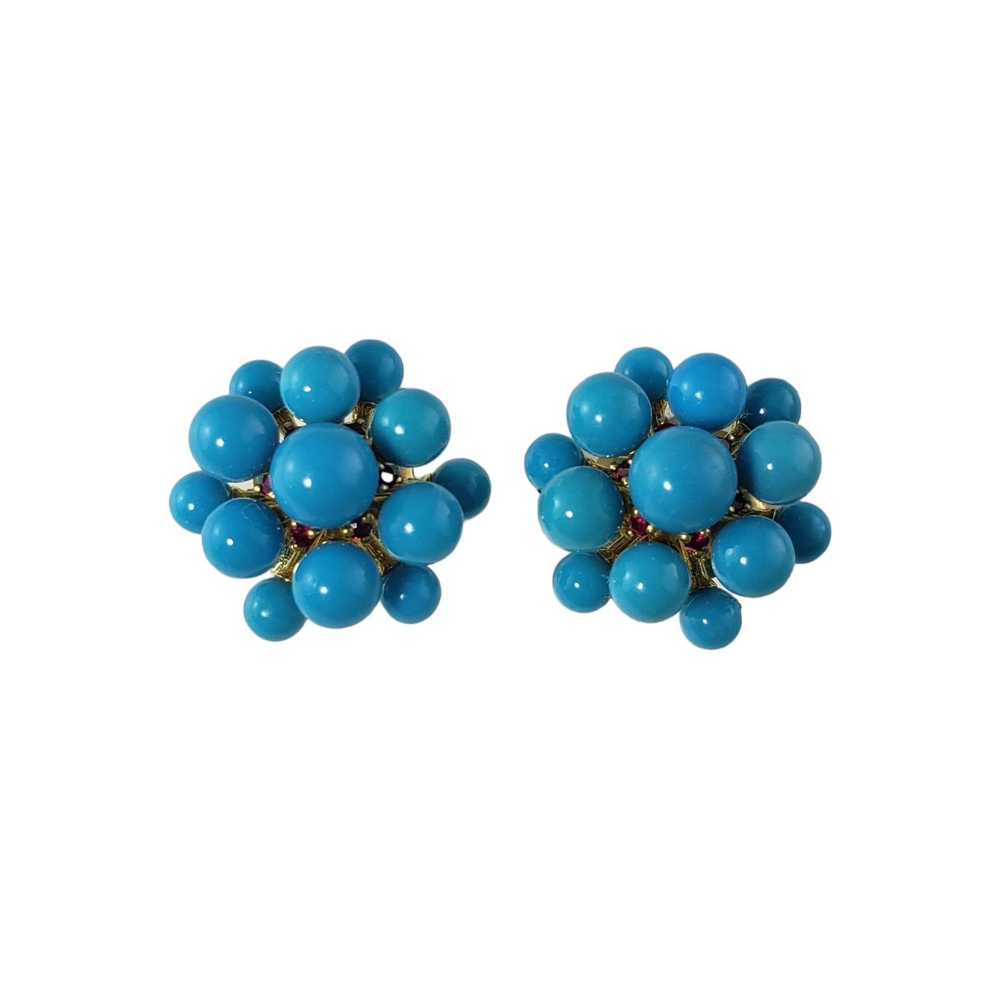 Paul Morelli 18 Karat Yellow Gold Turquoise and Ruby Orbit Cluster Earrings-

These lovely Paul Morelli earrings are decorated with turquoise and ruby gemstones set in classic 18K yellow gold.  Push back closures.

Total turquoise weight:  10.48