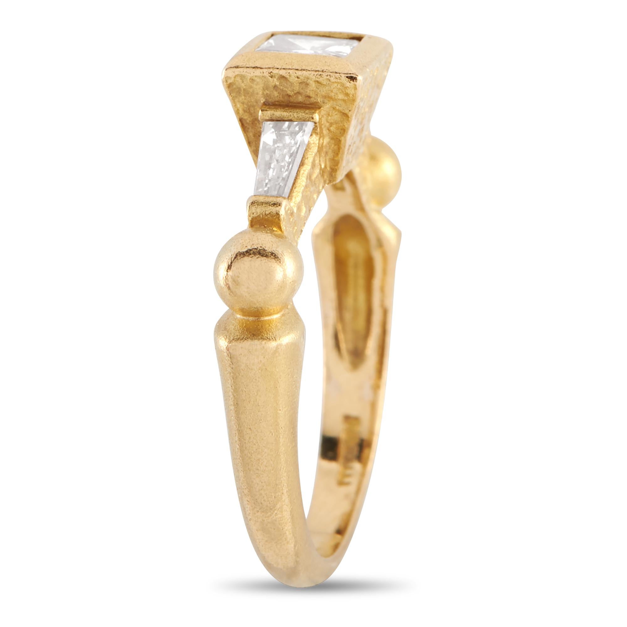Introducing a geometric and chic ring from the House of Paul Morelli, crafted in 18K yellow gold and adorned with three carefully selected diamonds. It features a solid 18K yellow gold band with a slim profile and a sandblasted finish. Its