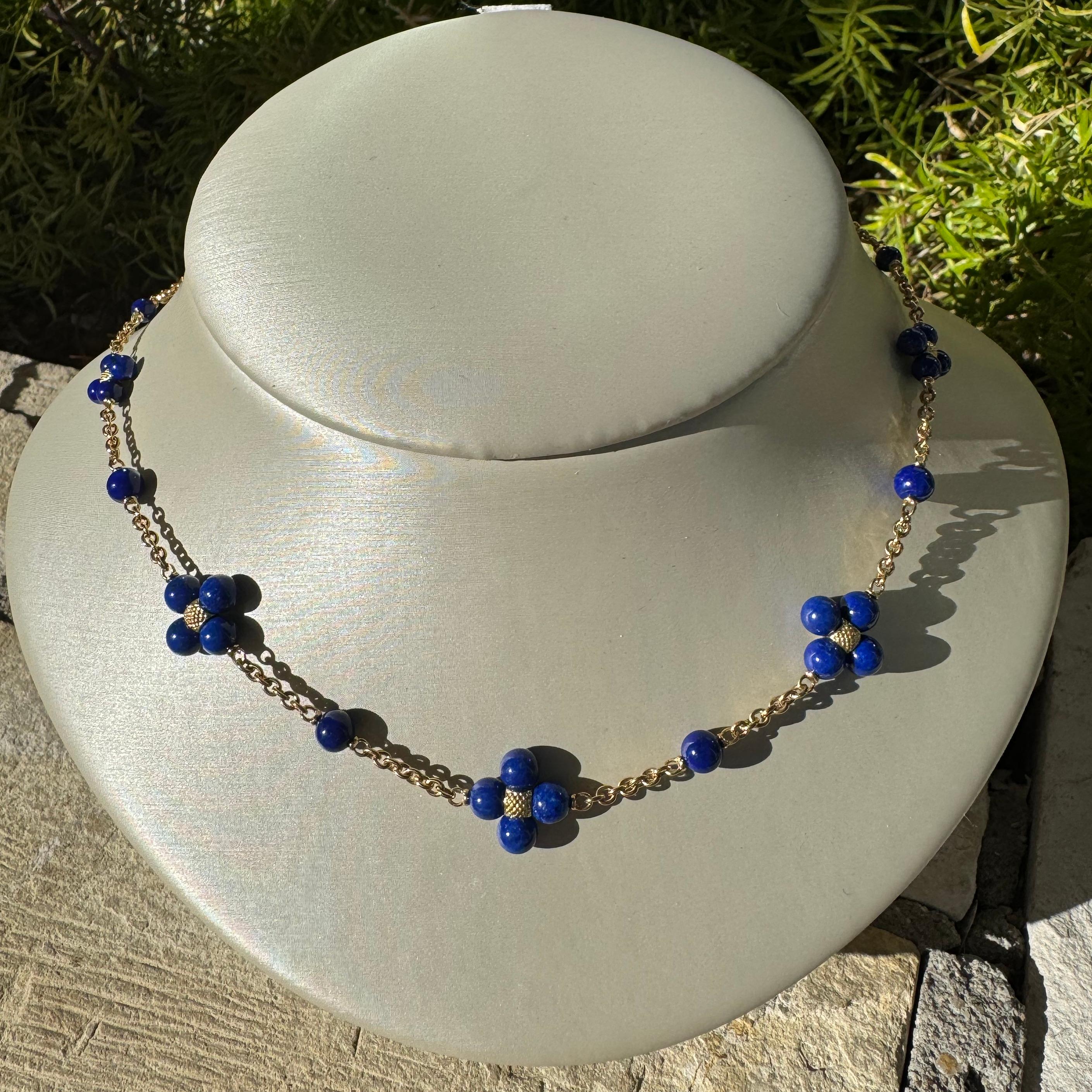Make an elegant entrance statement in this Paul Morelli Sequence necklace. Exquisitely elegant, this delicate gold chain is adorned with an orbit of round Lapis clusters. Create lasting memories with this radiant piece and add to your collection