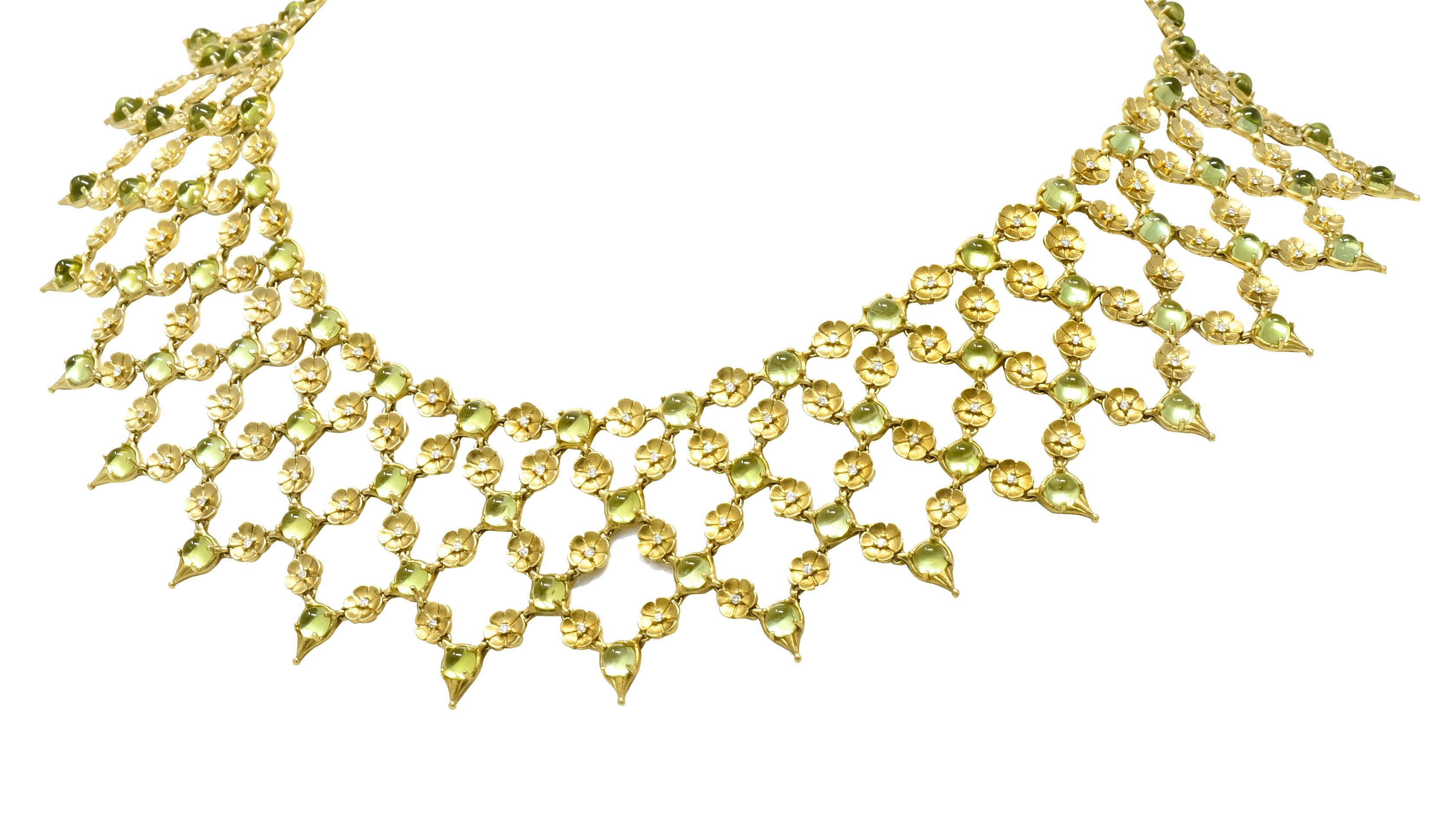 Fringe style necklace designed as small matte gold flowers creating a mesh chain link formation with pointed drops

Set throughout by prong set round cabochon peridot weighing approximately 30.52 carat total, transparent and light yellowish green in