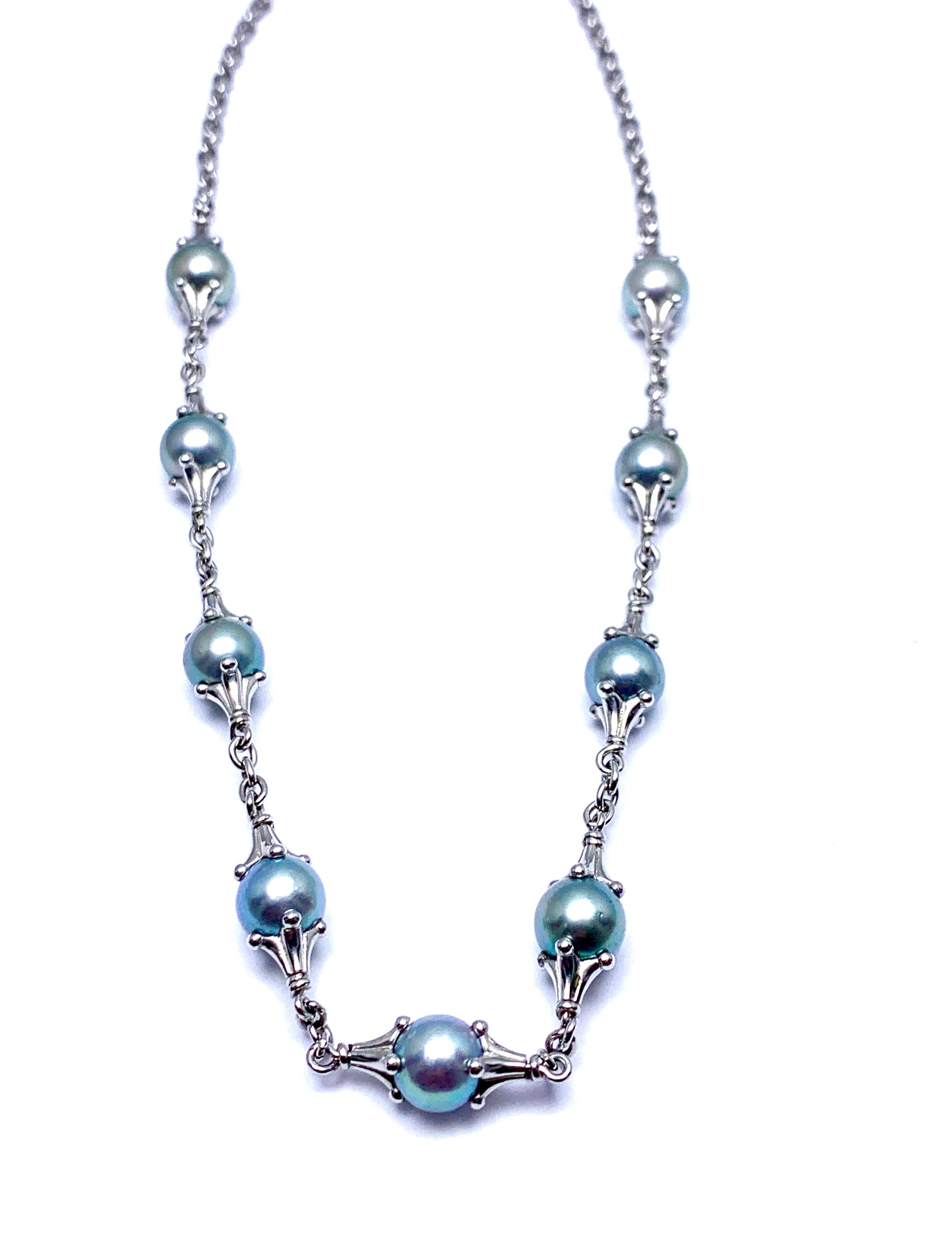 A gorgeous Paul Morelli cultured Tahitian Pearl and platinum necklace.  The Pearls measure from 8.50 - 9.00mm, set in stations between links. The necklace measures 16.50 inches in length, and features a toggle clasp. Signed 