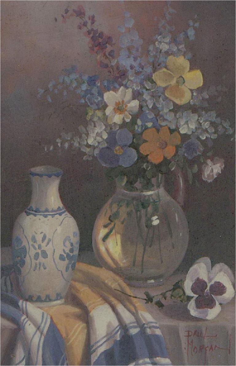 A fine and delicate oil painting by the artist Paul Morgan, depicting a still life with dainty flowers in a clear jar and a ceramic blue and white vase. Signed to the lower right-hand corner. Well-presented in a distressed slip and in an ornate,