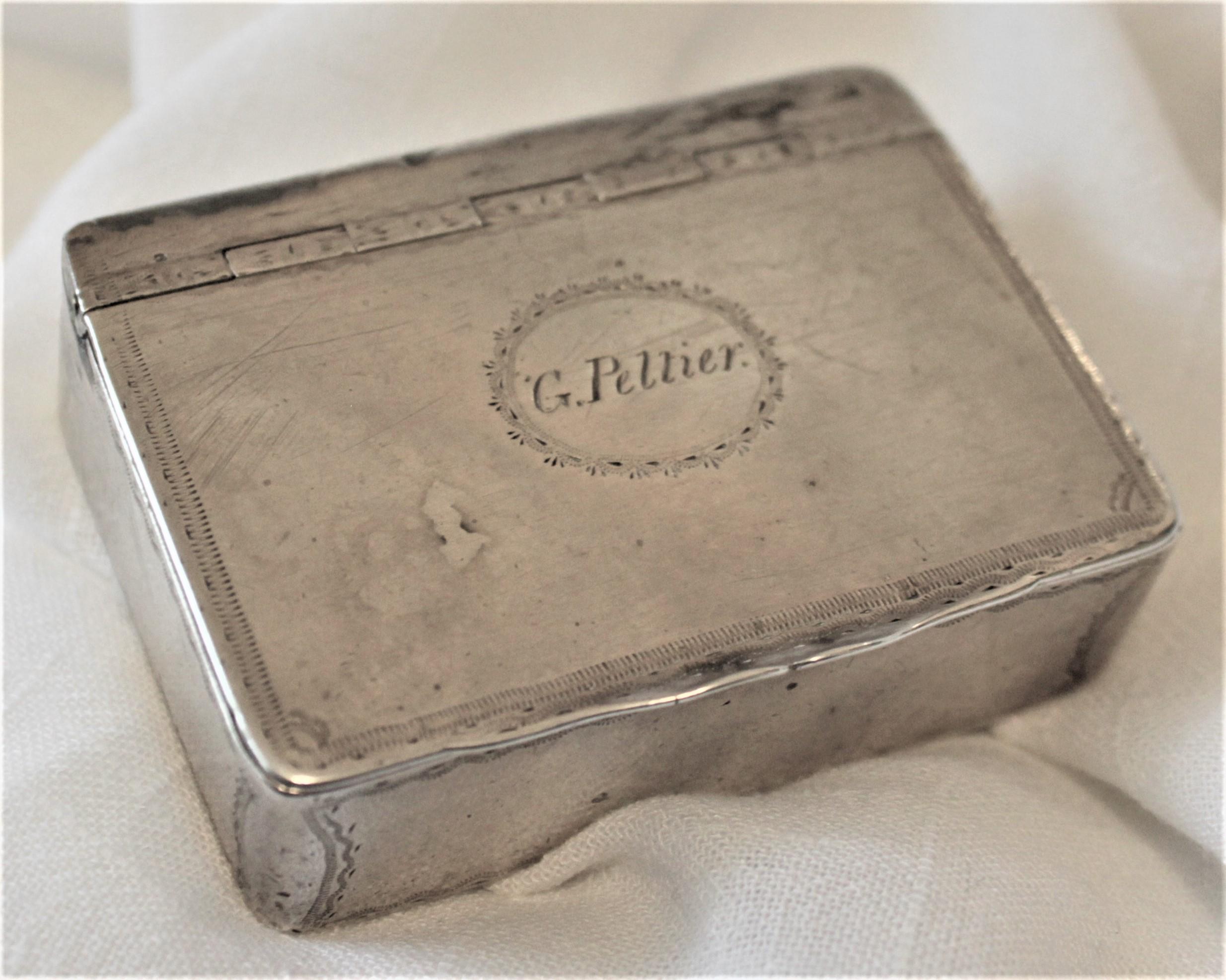 This antique sterling silver snuff box was made by the noted Canadian silversmith Paul Morin from Quebec City of Lower Canada, and dates to circa 1795-1805 in a period Georgian style. This very early Canadian snuff box is naively decorated in a