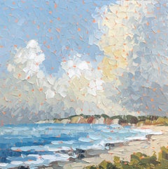 "After the Storm" clouds fill the horizon above ocean cliffs & vibrant blue sea