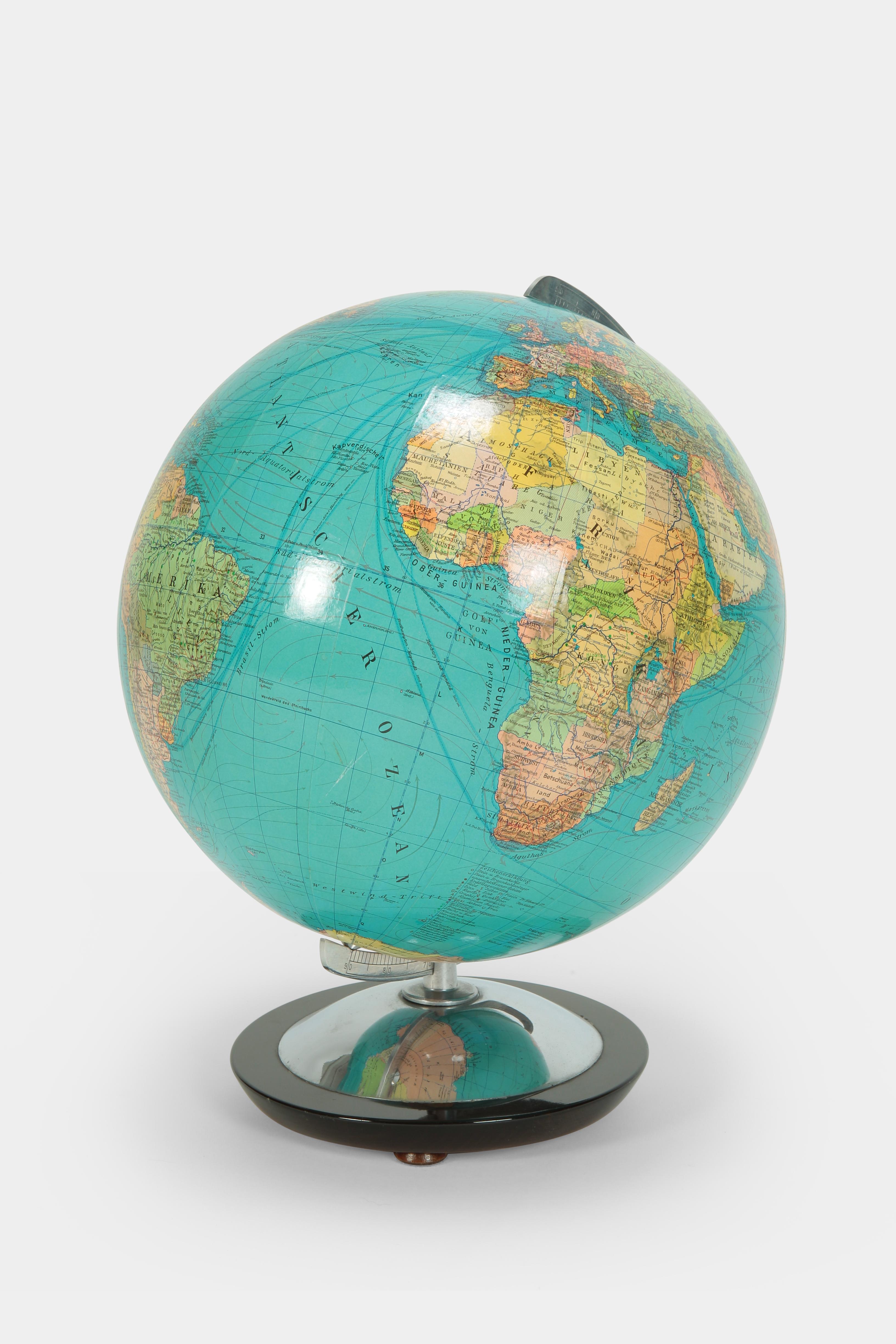 Paul Oestergaard globe manufactured by Columbus Verlag in the 1960s in Germany, Berlin. Classic globe on a base made of solid wood.