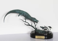 En el río de hierba "La persecución", escultura de bronce de Paul Oestreicher