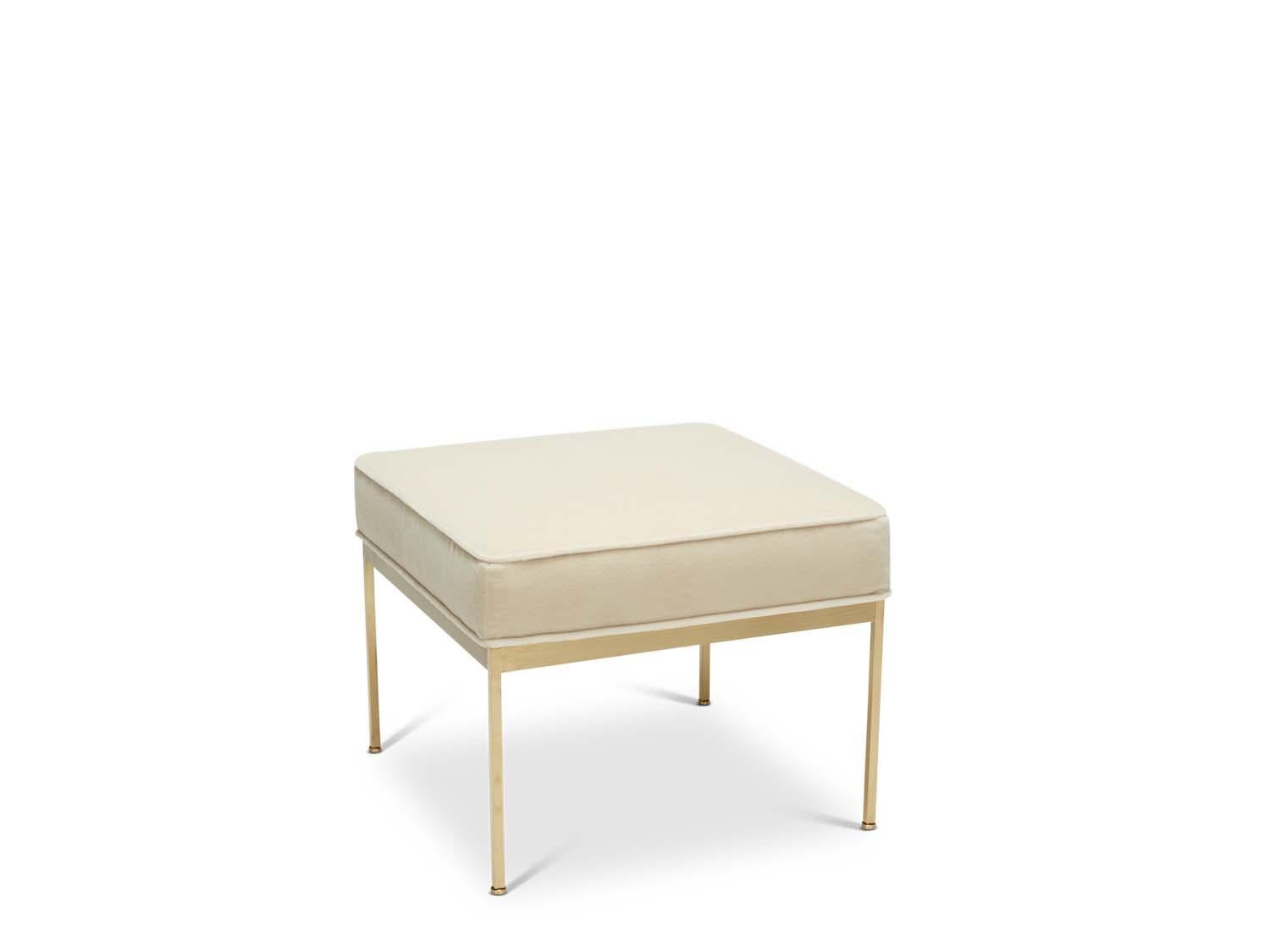 The Paul Ottoman features a solid lacquered brass base and an upholstered seat with piping. Each leg features a rounded leveler.

Inspired by the clean lines and brass detailing of early mid-century Paul McCobb designs.

The Lawson-Fenning