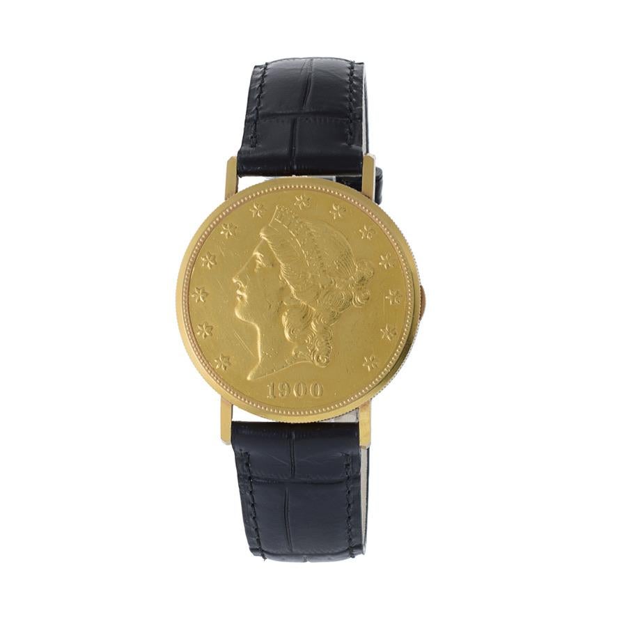 This is rare 1960's Paul Peugeot $20 18K and 22K gold coin watch. This watch was manufactured with a real 22K gold US 1900 $20 piece. The watch movement is behind a spring actuated cover. The watch measures 35mm in diameter.

The watch is powered by