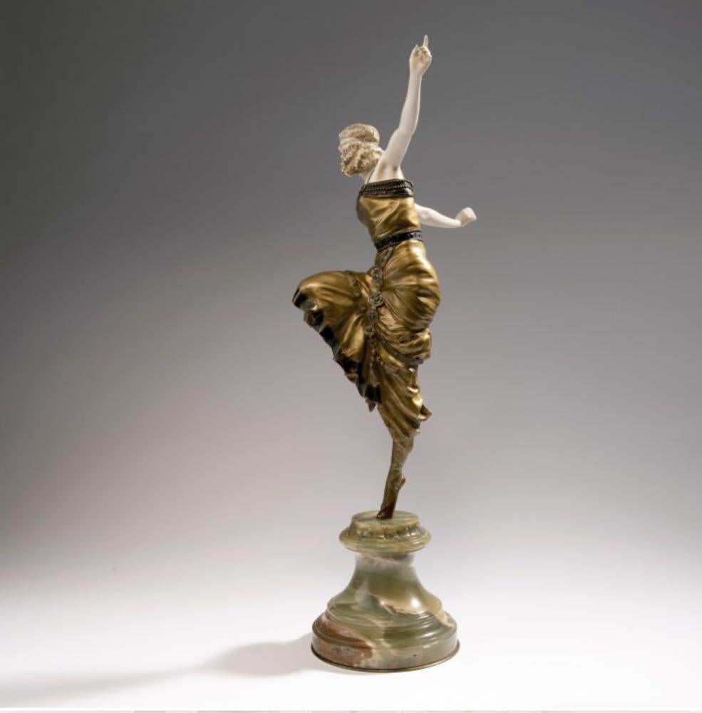 Paul Philippe (1870-1930)
'Russian Dancer':: une figure en bronze et ivoire
Peint à froid et doré:: représentant une jeune danseuse les bras levés:: un pied numéroté:: sur un socle en pierre dure signé P. Philippe:: mesure : 60cm. 

Le modèle de