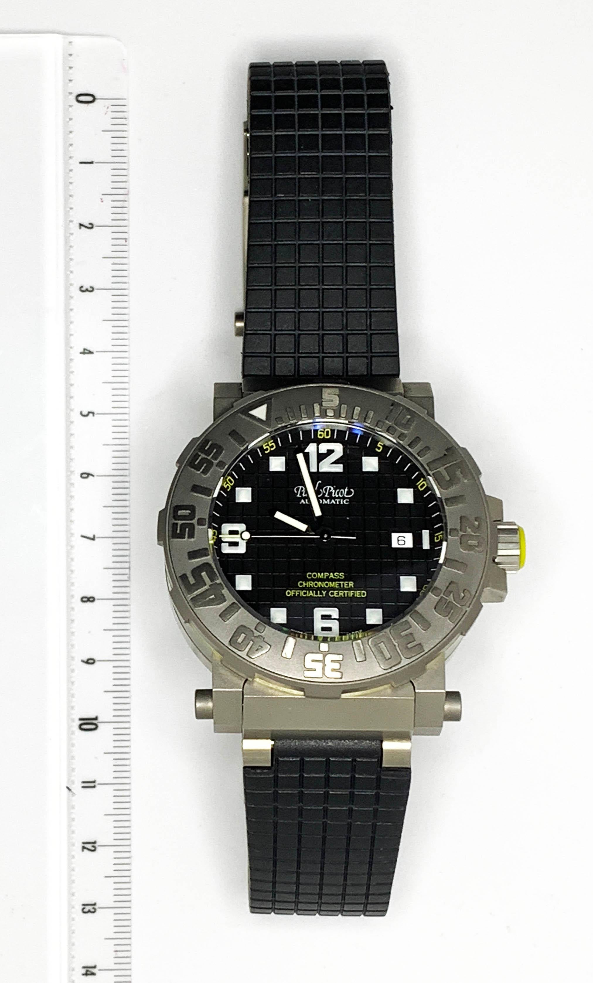 Paul Picot
The Diver
rare diver's watch
titanium and rubber
automatic
certified chronometer
water-resistant to 100 metres
date at 3 o'clock
retractable case to make room for a compass
circa 2008
new from stock
box/paper
new value: 7500 euros
2500