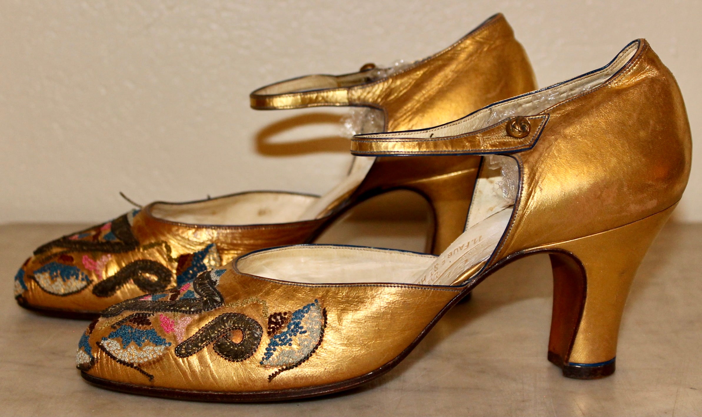 Gold leather, fine glass bead embroidered pumps with  colorful French Art Deco motifs.  A single strap, with signature 