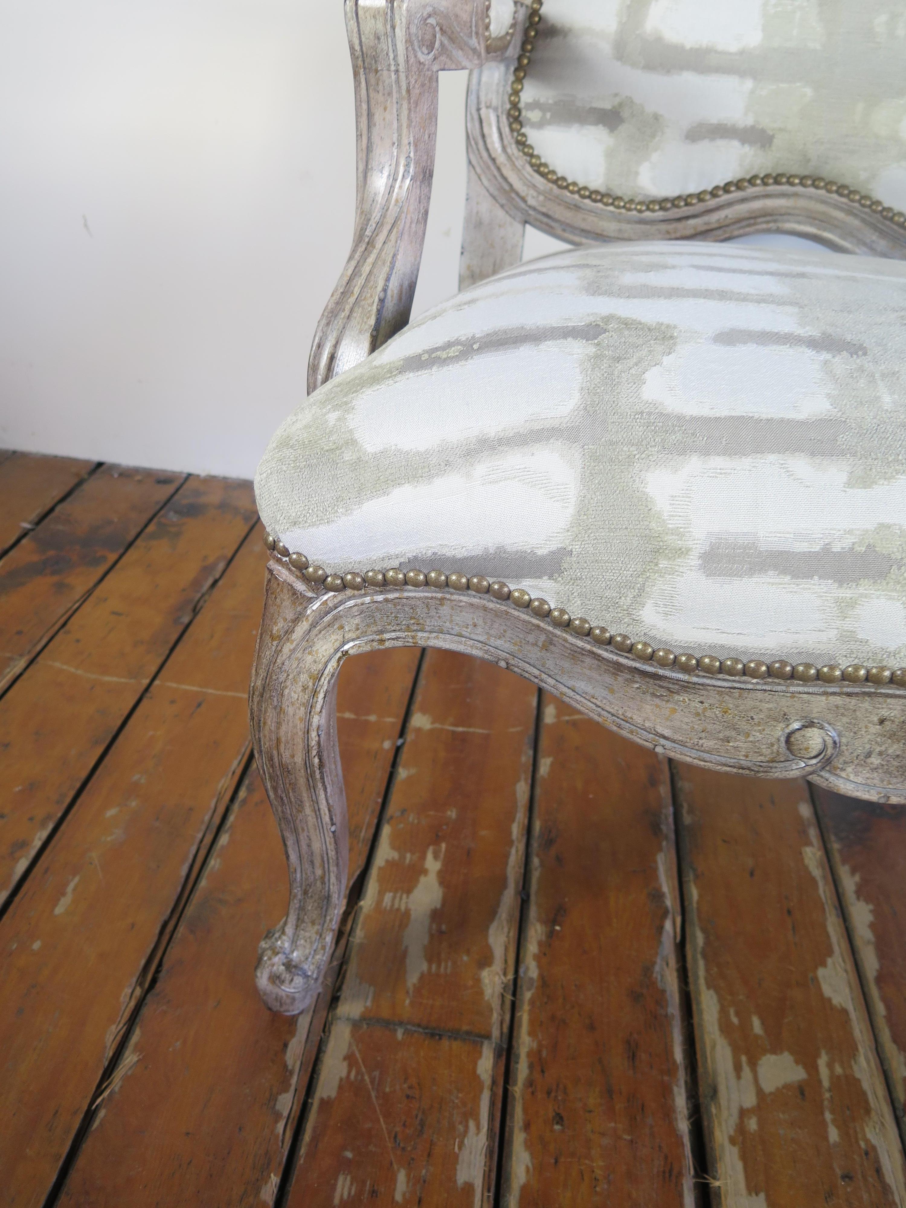 Paul Robert wooden chair with brush stroked pattern, nailhead trim and Finnish linen.