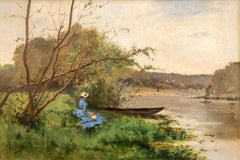 Frau am Ufer des Flusses