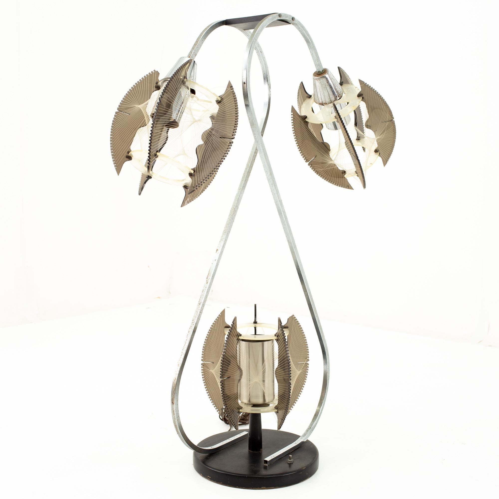 Paul Secon for Sompex Mid Century string and chrome lamp
Lamp measures: 28 wide x 12 deep x 41.5 high

This price includes getting this piece in what we call restored vintage condition. That means the piece is permanently fixed upon purchase so it’s