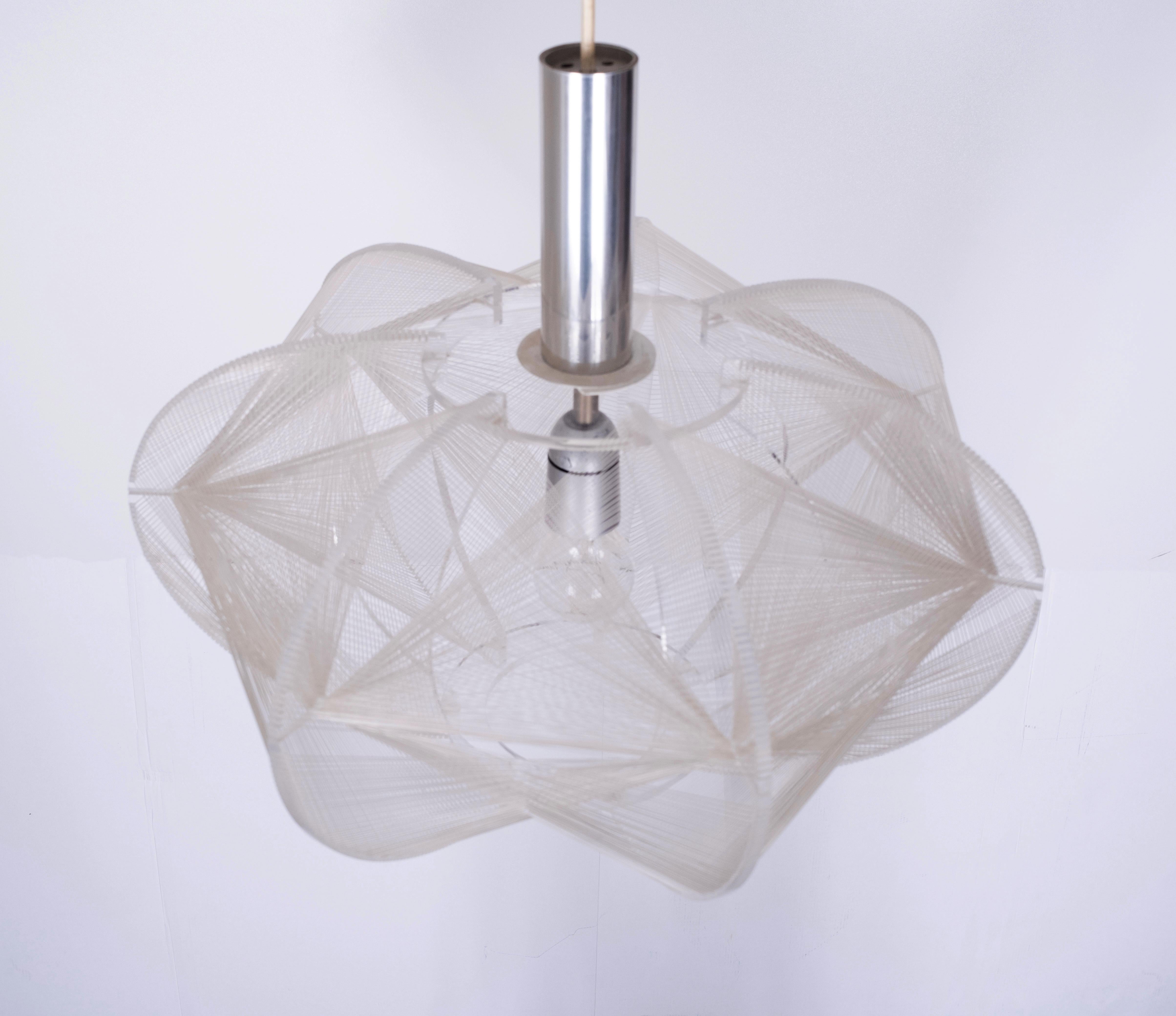 Beautiful wire pendant lamp by Paul Secon for Sompex. The lamp is made of clear Lucite with woven strings surrounding the light bulb. Very good condition.