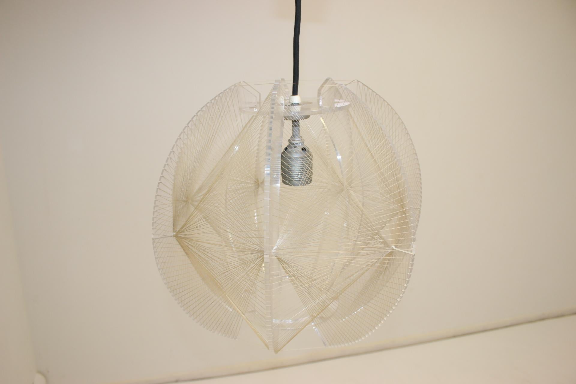 A beautiful ceiling lamp from the 60s, designed for Sompex by the French designer Paul Secon. 
The lamp has a clear plexiglass frame with threaded nylon filament plus chrome fixings. 
A perfect use of shape and materials for a lamp, it looks great