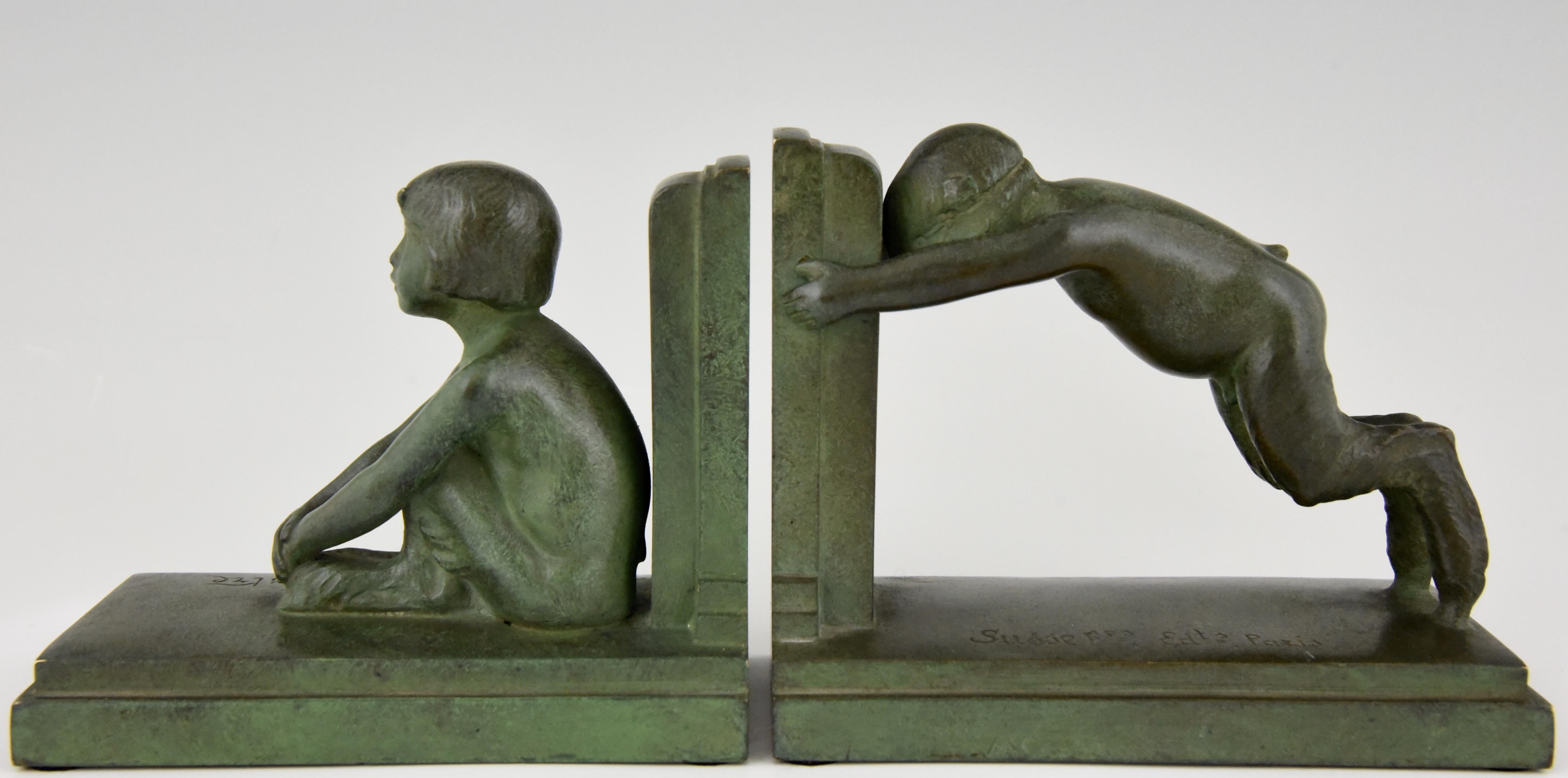 “Sit and push” Art Deco bronze bookends boy and girl satyr.
Signed by Paul Silvestre, with Susse Freres founders' signature, France, circa 1920. Reduced version of the “Miroir d’eau” fountains in Paris and Lucerne.
Illustrated in 