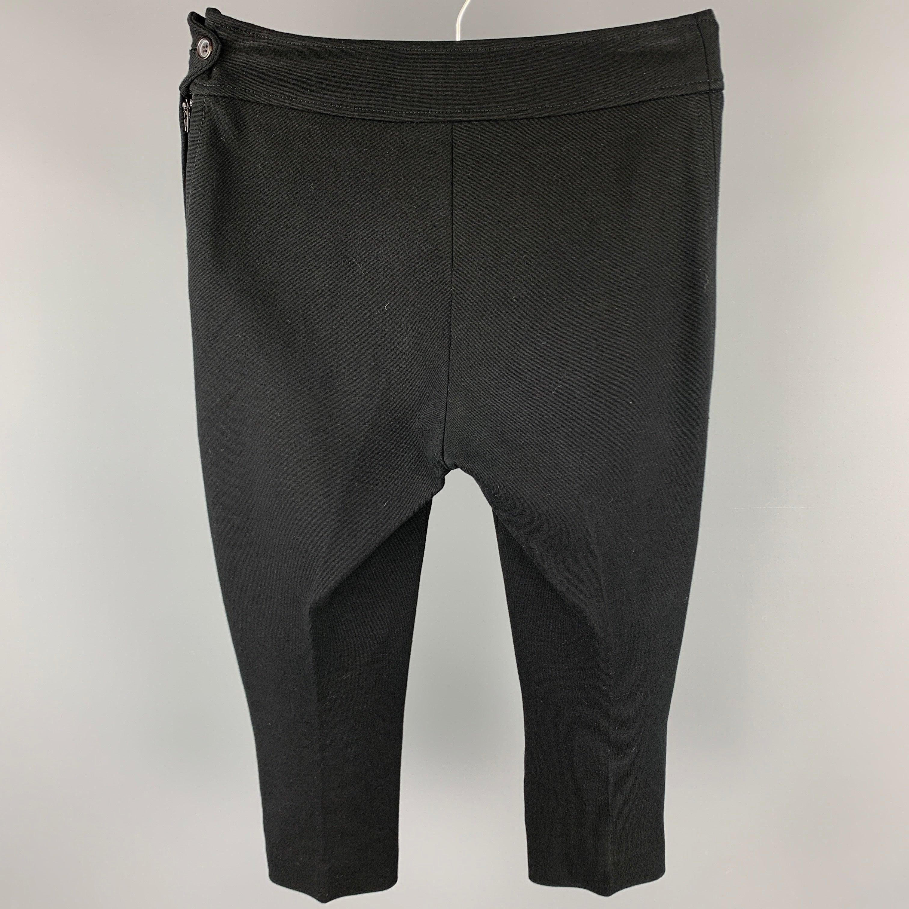 PAUL SMITH Blue leggings comes in a black rayon blend featuring a cropped style and a side button & zip up closure. Made in Italy.Good
Pre-Owned Condition. 

Marked:   IT 40 

Measurements: 
  Waist: 28 inches Rise: 8 inches 
Inseam: 19 inches 
  
 