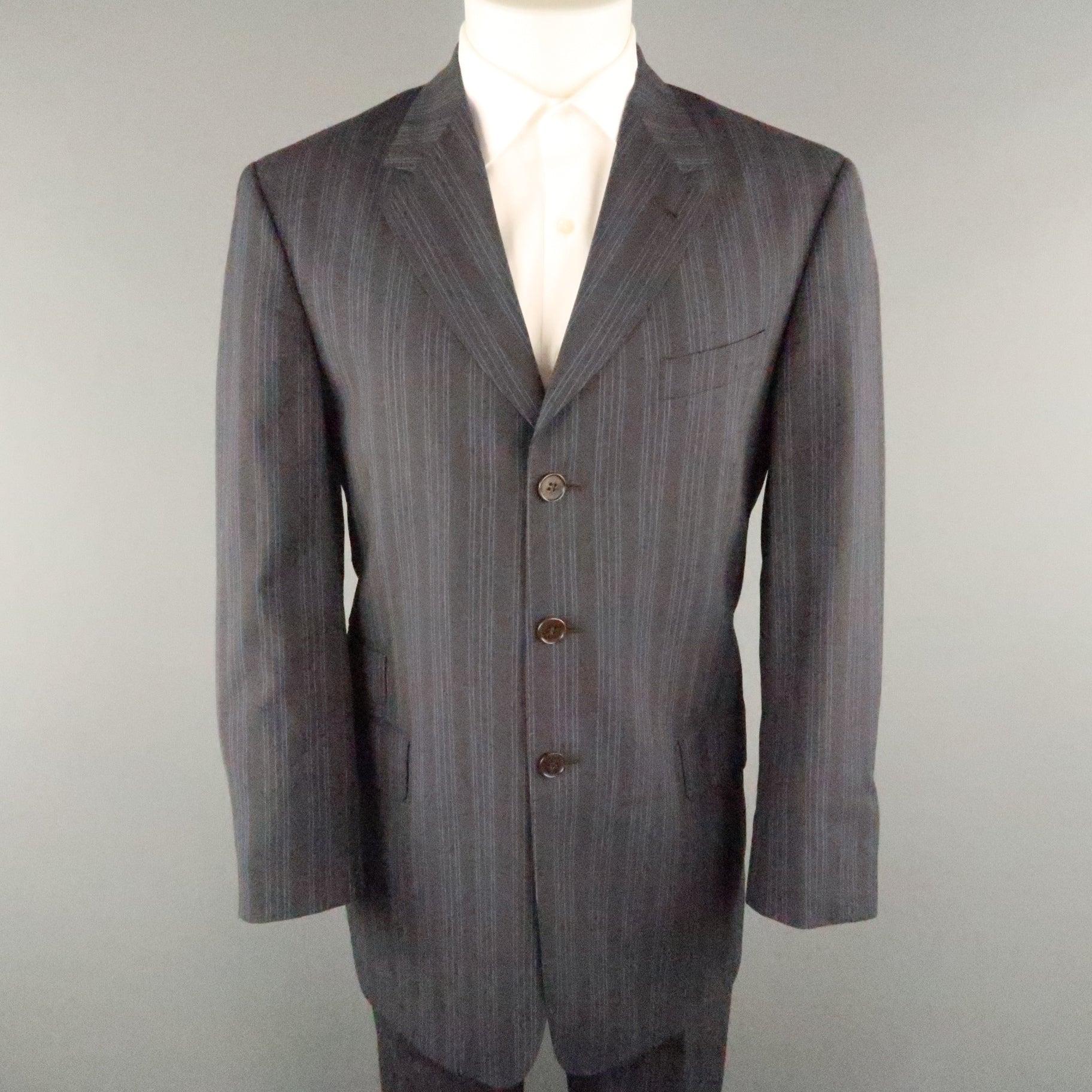 PAUL SMITH suit comes in gray and blue stripe viscose featuring a notch lapel, flap pockets, three button closure, and matching flat front style pants. Made in Italy. 
Excellent Pre-Owned Condition.
 

Marked:   40
 

Measurements: 
 