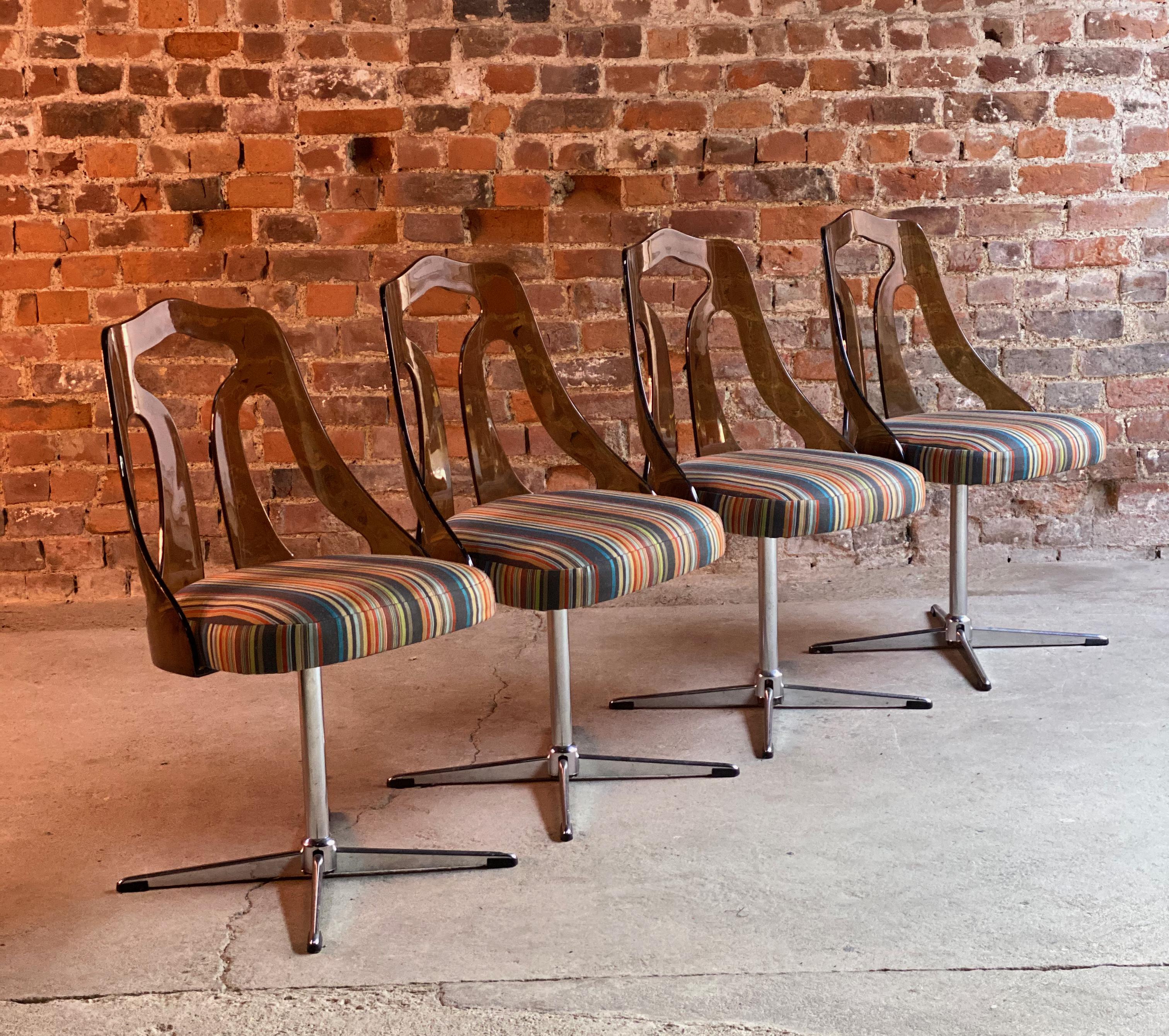 Paul Smith ottoman Maharam dining chairs set of four, circa 1960s
Magnificent set of four revolving dining chairs circa 1960s, each chair with pierced bronze Lucite back rests raised on four branch aluminium seat bases, upholstered in Paul Smith