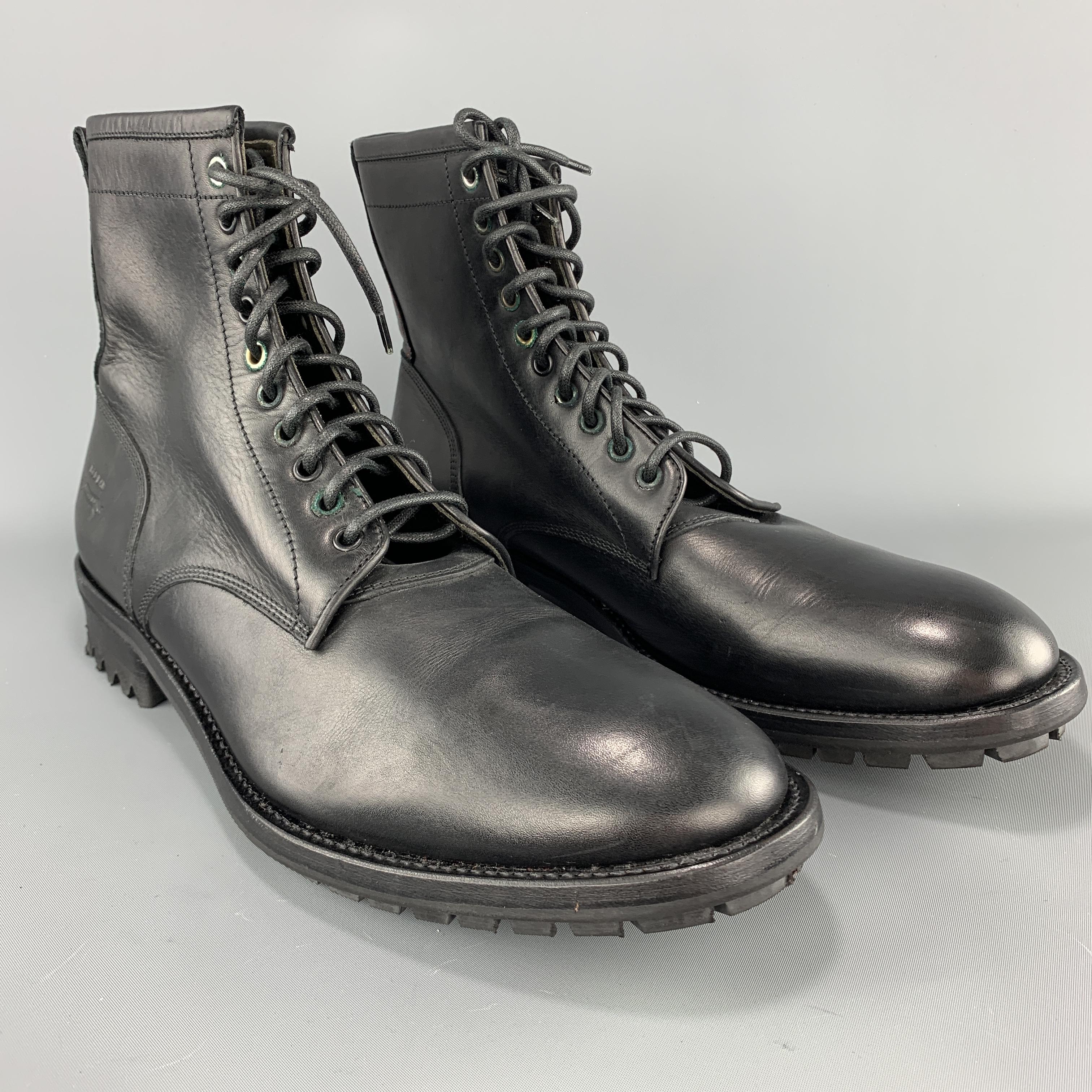 RED EAR PAUL SMITH boots come in black leather with a heeled rubber sole and lace up front. Made in Italy.

Excellent Pre-Owned Condition.
Marked: UK 11

Outsole: 13 x 4.5 in. 
Height: 6.5 in.