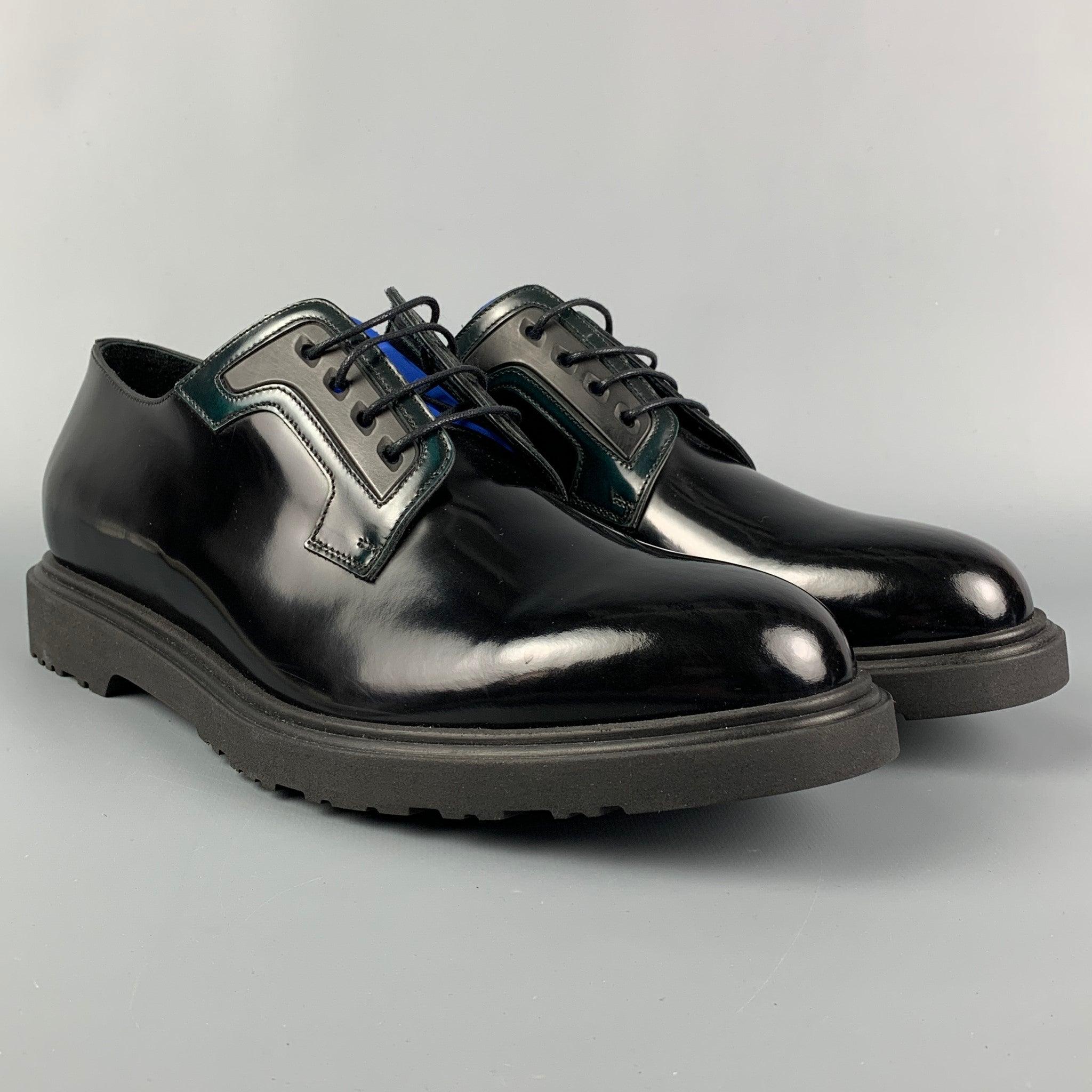 PAUL SMITH shoes comes in a black leather with a blue trim featuring a cap toe and a lace up closure. Made in Italy.
Brand New.
 

Marked:   40784 MACO04 43 9 Outsole: 12.5 inches  x 4.75 inches 
  
  
 
Reference: 114024
Category: Lace Up