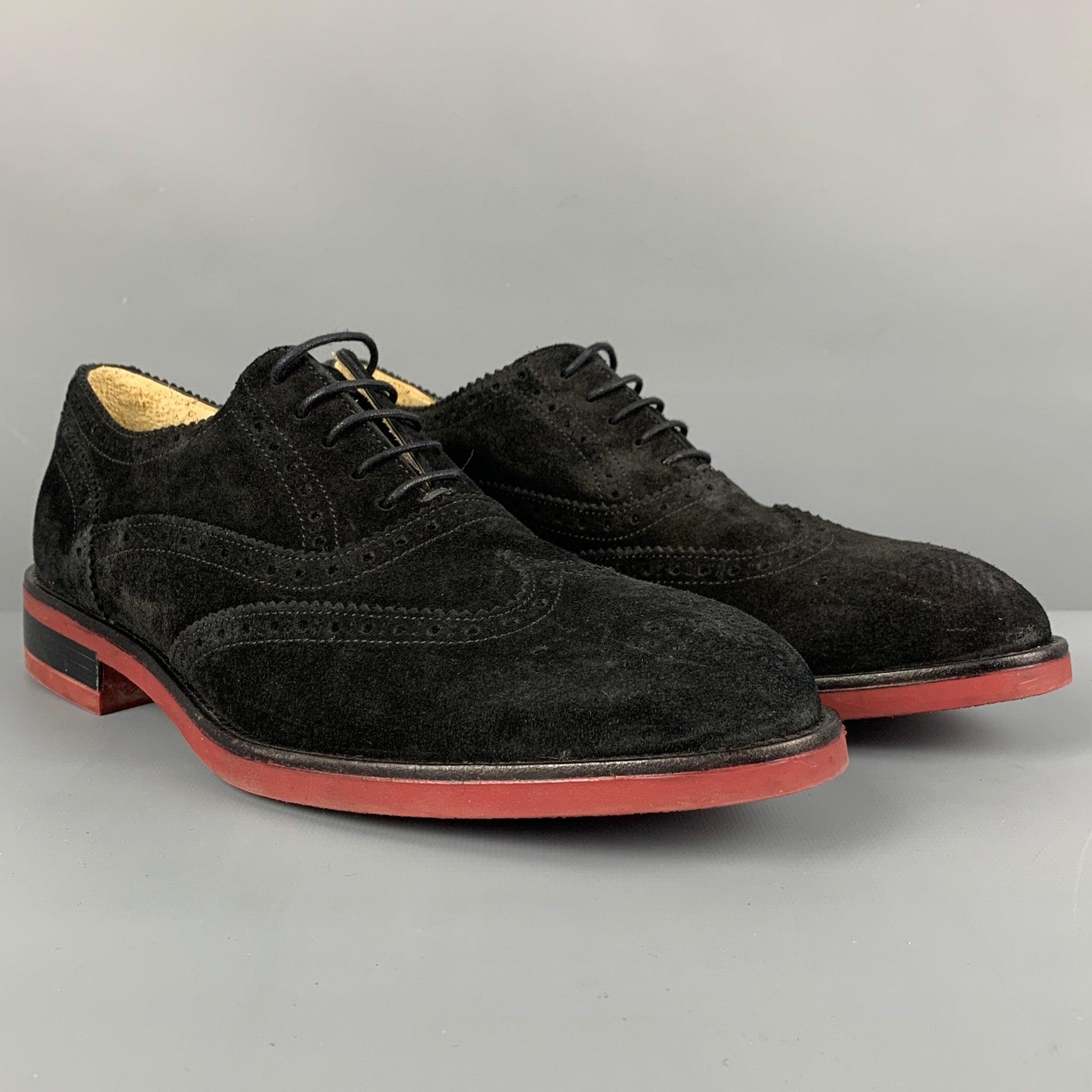 PAUL SMITH shoes comes in a black & brick perforated suede featuring a wingtip style and a lace up closure. Made in Italy. Very Good
Pre-Owned Condition. 

Marked:   No size markedOutsole: 12.25 inches  x 4.5 inches 
  
  
 
Reference: