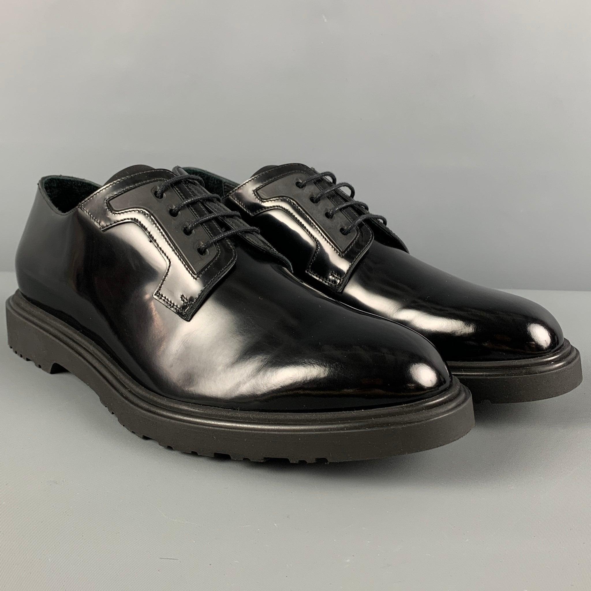 PAUL SMITH shoes comes in a black leather featuring a round toe, panel details, and a lace up closure. Made in Italy.
Very Good
Pre-Owned Condition. 

Marked:   40781 MAC01 44 10Outsole: 12.5 inches  x 4.75 inches 

  
  
 
Reference: