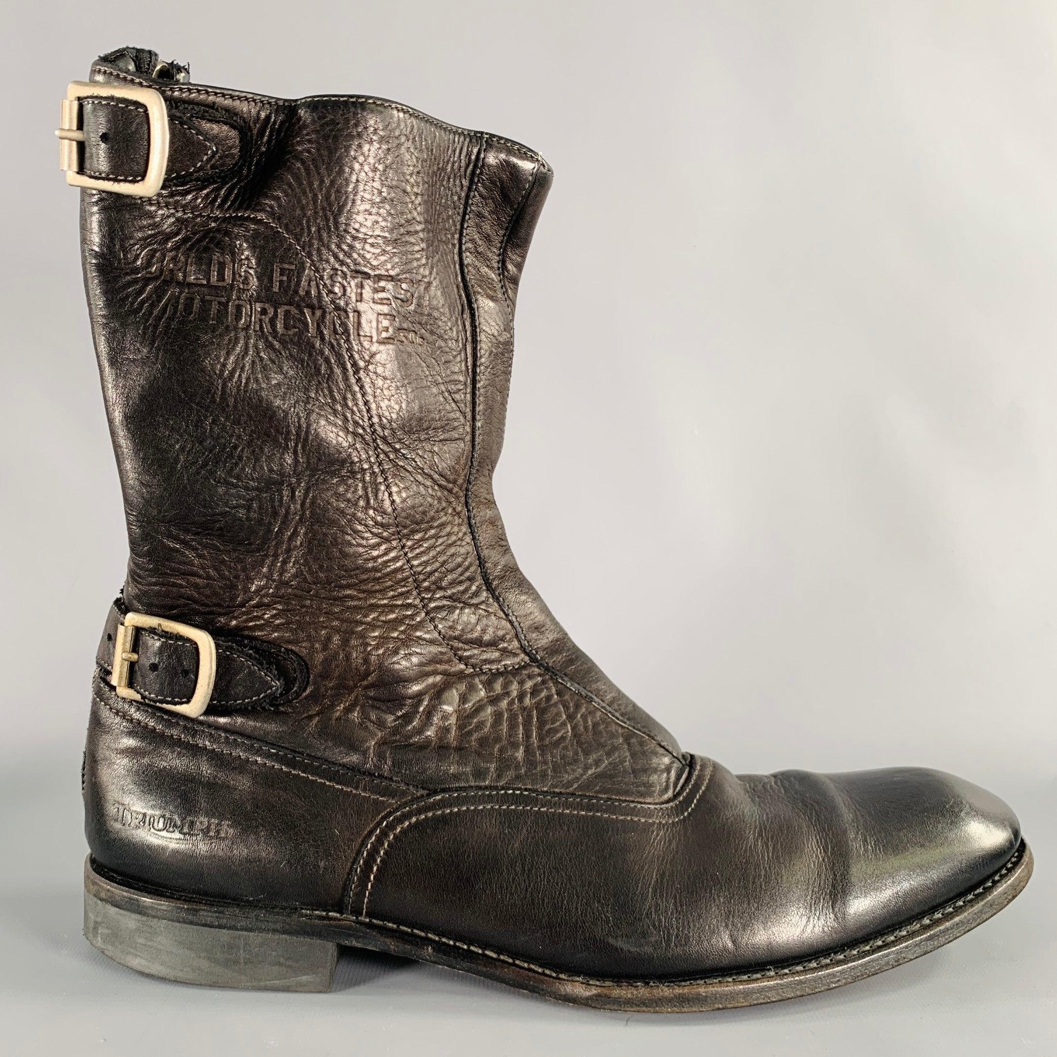 TRIUMPH by PAUL SMITH boots
in a
black leather featuring a motorcycle style with two silver tone buckle accents, and back zipper closure. Made in Italy.Very Good Pre-Owned Condition. Moderate signs of wear, as is. 

Marked:   1088 45 11