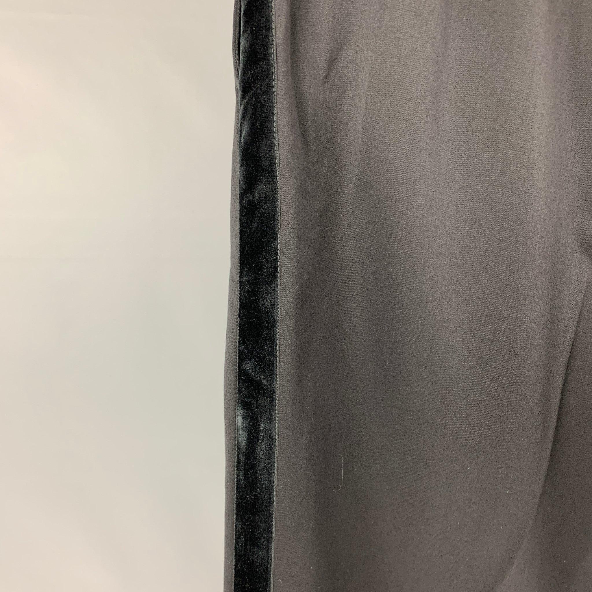 PAUL SMITH dress pants comes in a black wool featuring a flat front, cuffed leg, velvet tuxedo stripe, and a zip fly closure. Made in Italy.
Very Good
Pre-Owned Condition. 

Marked:   36 

Measurements: 
  Waist: 36 inches  Rise: 12 inches  Inseam: