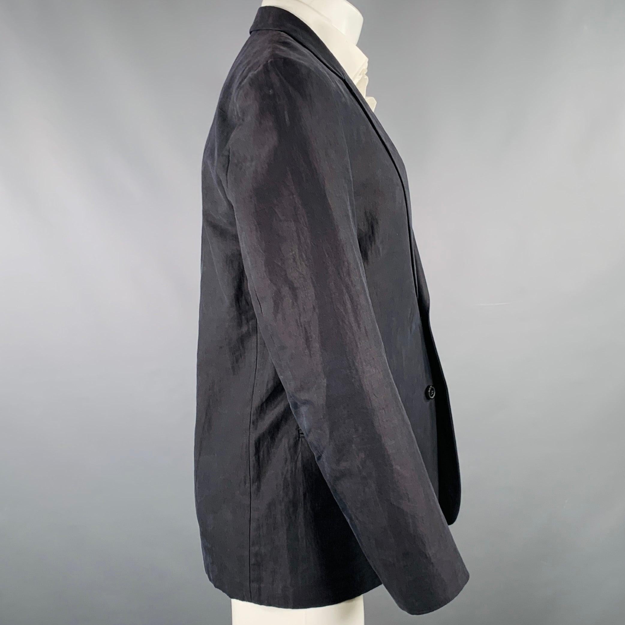 PAUL SMITH sport coat
in a black cotton blend fabric featuring a notch lapel, ventless back, and single button closure with second button detail. Made in Italy.Very Good Pre-Owned Condition. Minor mark near button. 

Marked:   38 

Measurements: 
