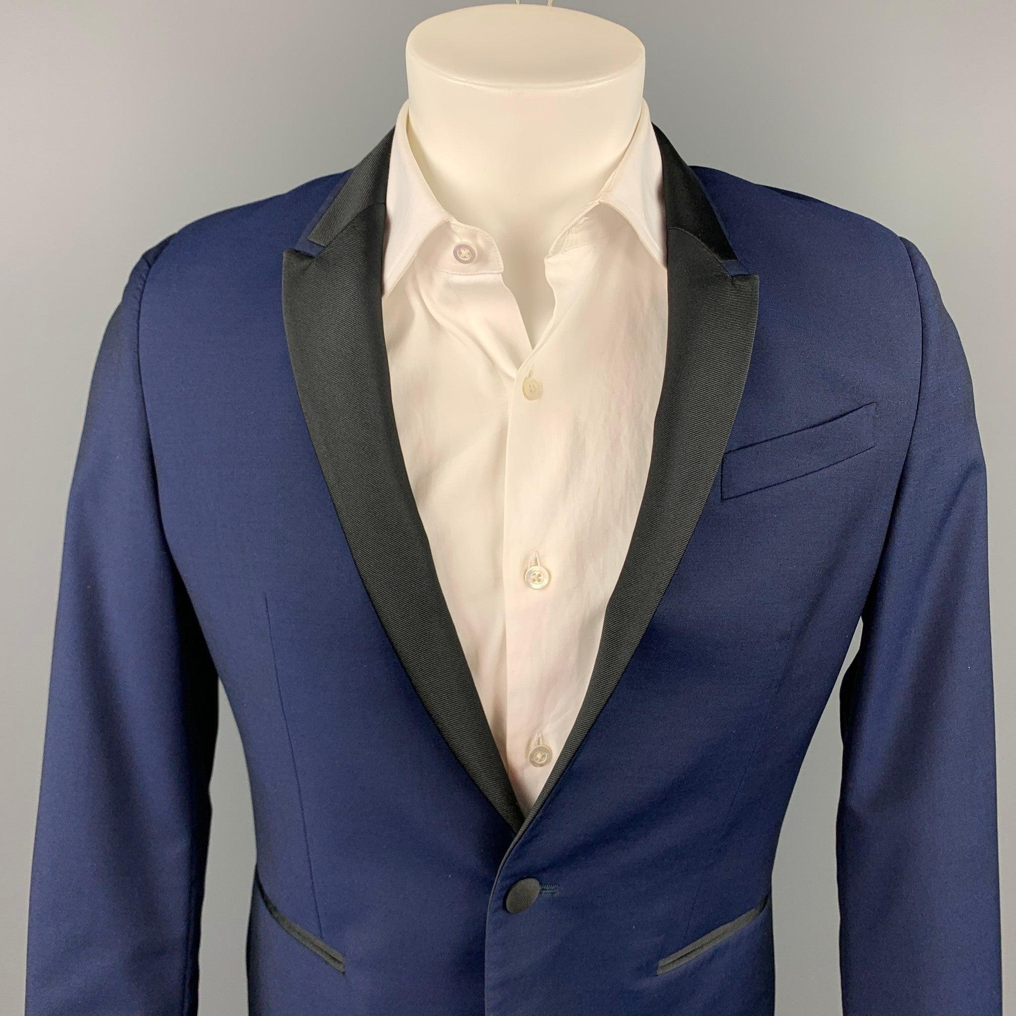 PAUL SMITH sport coat comes in a navy wool / mohair with a full liner featuring a peak lapel, slit pockets, and a single button closure. Made in Italy.Very Good
Pre-Owned Condition. 

Marked:   38 R 

Measurements: 
 
Shoulder: 16.5 inches  Chest:
