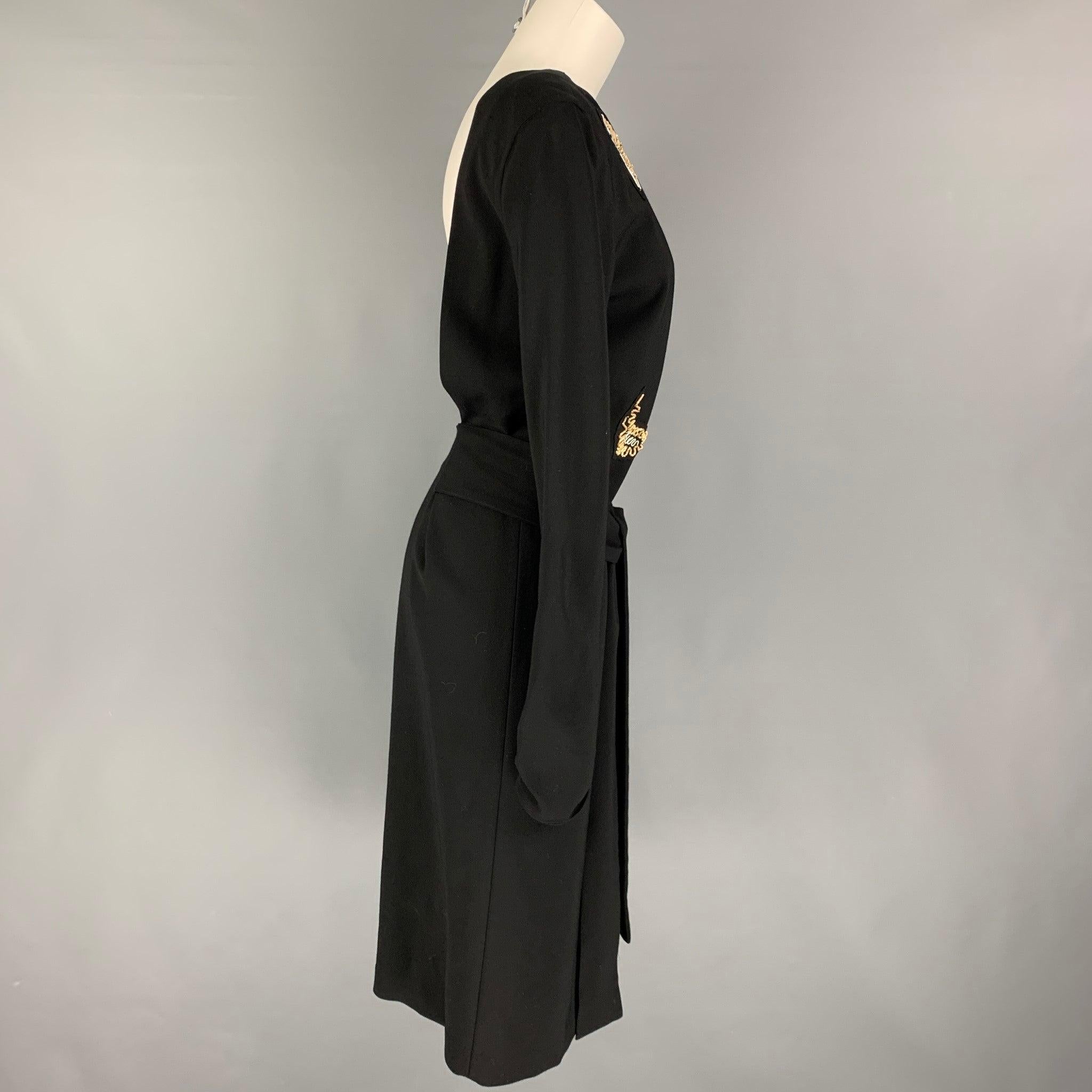 PAUL SMITH dress comes in a black viscose featuring a open back, sequined patches, and a front self tie detail.
Very Good
Pre-Owned Condition. 

Marked:   40 

Measurements: 
 
Shoulder: 16 inches  Bust: 34 inches Waist: 33 inches  Hip: 37 inches 