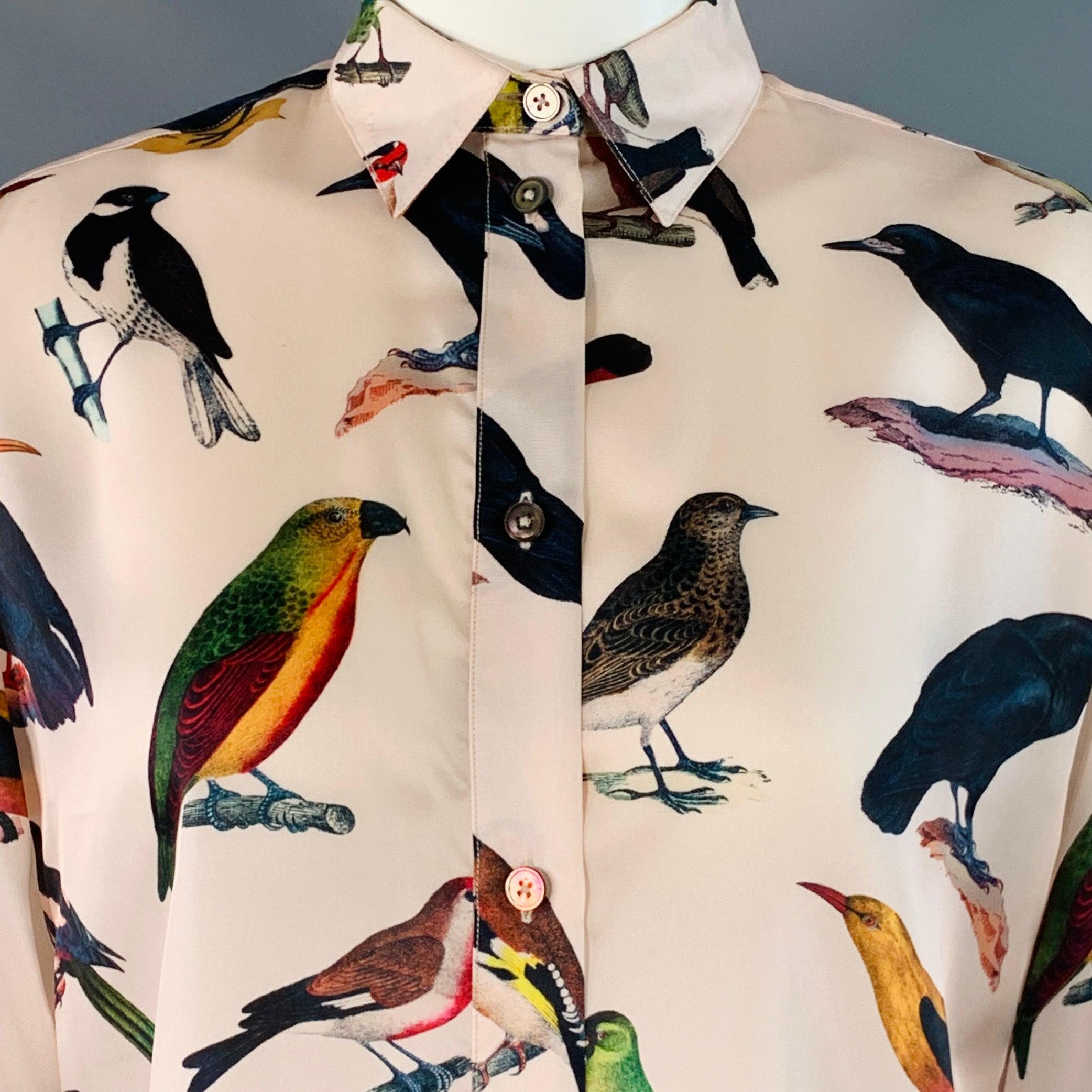 Camisa PAUL SMITH
en cupro rosa y multicolor con estampado de pájaros, cuello de pico y cierre de botones. Made in Italy. Muy buen estado de conservación. Varias marcas menores. 

Marcado:   IT 40 

Medidas: 
 
Hombros 16 pulgadas Busto: 42 pulgadas