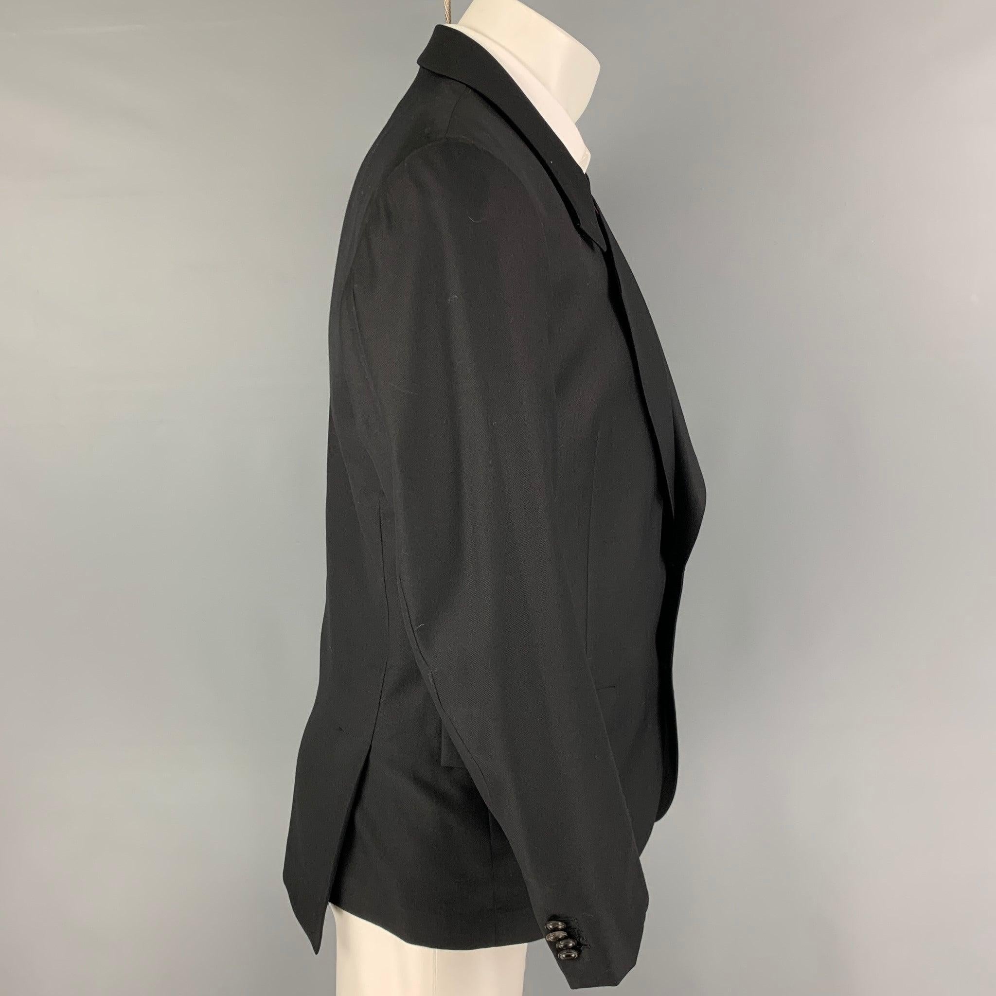 PAUL SMITH sport coat comes in a black wool / silk with a full liner featuring a notch lapel, flap pockets, double back vent, and a double button closure. Made in Japan.
Excellent
Pre-Owned Condition. 

Marked:   40 

Measurements: 
 
Shoulder: 17.5