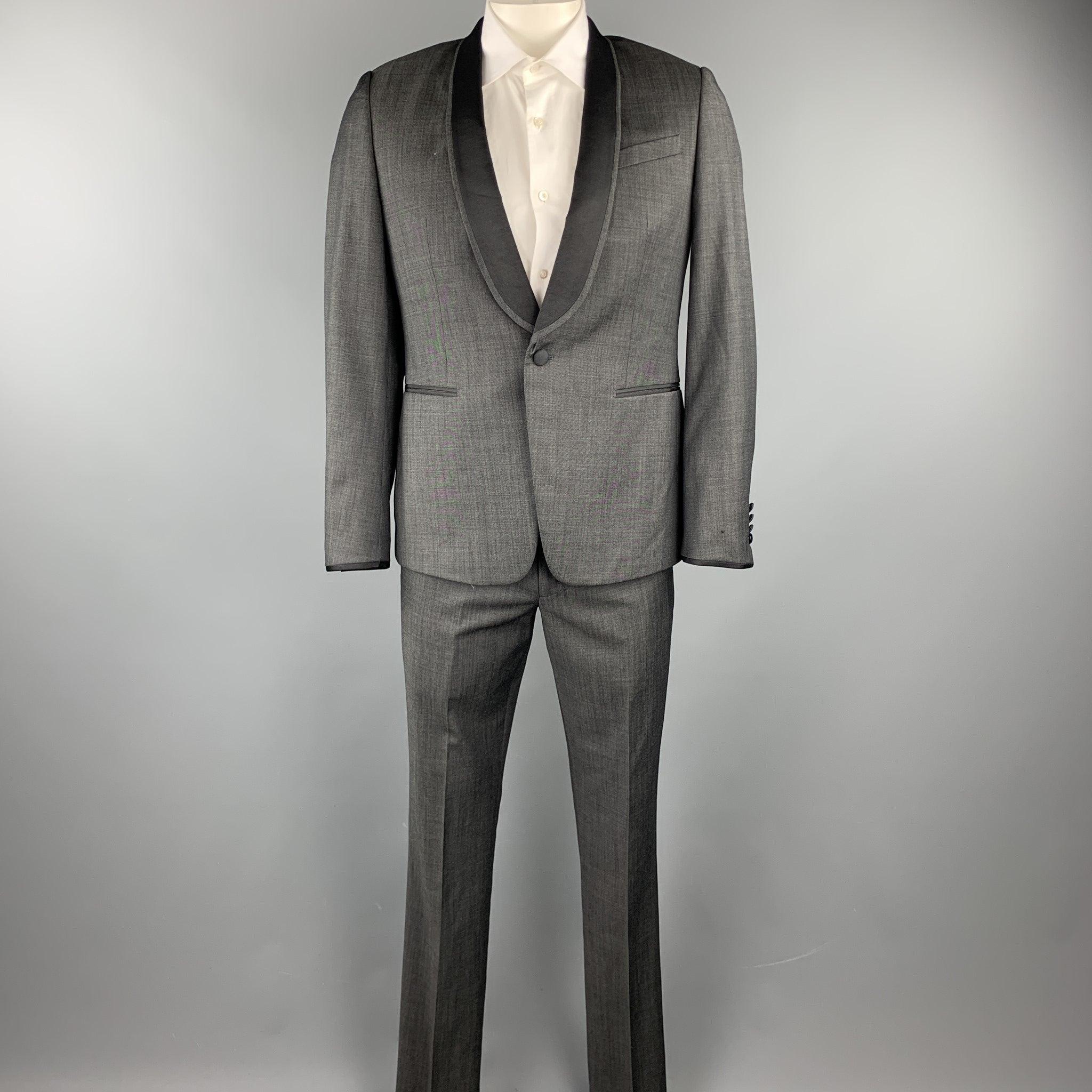 PAUL SMITH tuxedo
suit comes in a charcoal wool with a full gray liner and includes a single breasted, single button sport coat with shawl lapel and matching flat front trousers. As-Is. Made in Italy.Very Good Pre-Owned Condition. 

Marked:   R 40