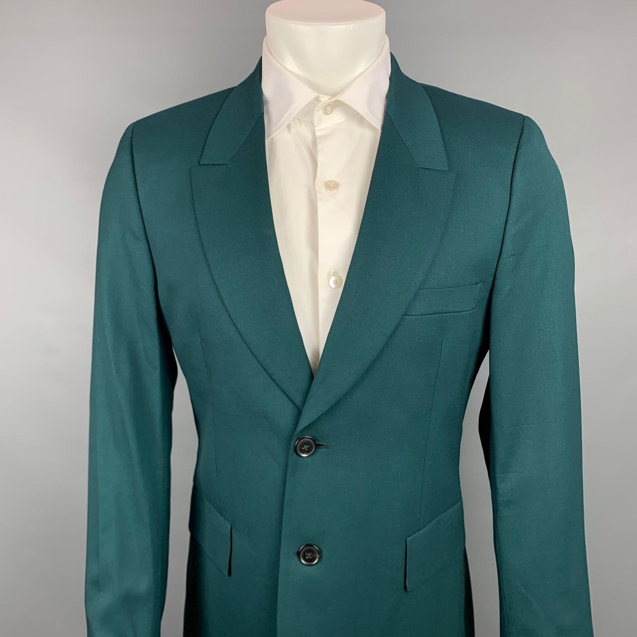 PAUL SMITH sport coat comes in a green wool with a full print liner featuring a notch lapel, flap pockets, and a two button closure. Made in Italy.Very Good
Pre-Owned Condition. 

Marked:   42 

Measurements: 
 
Shoulder: 17 inches  Chest: 40 inches
