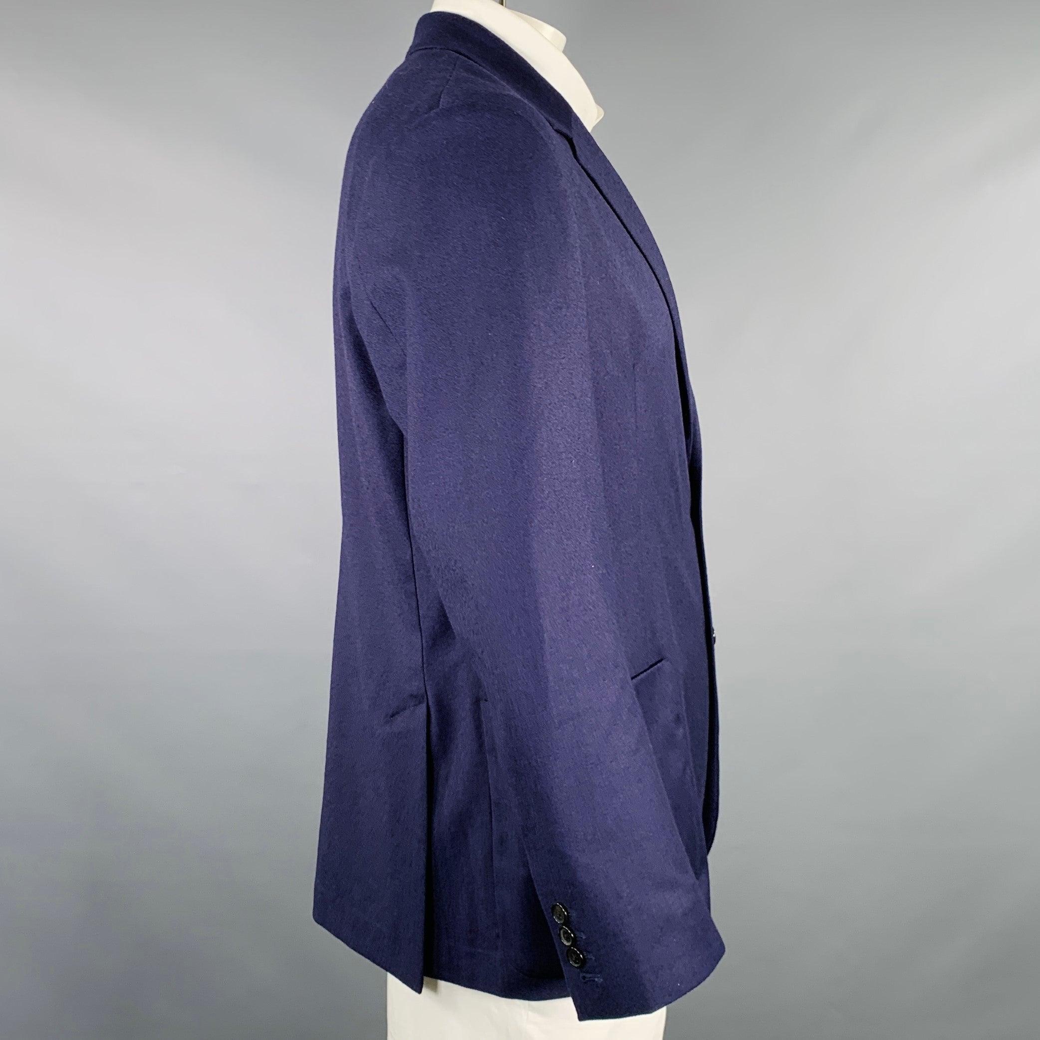 PAUL SMITH sport coat
in a navy wool cashmere blend fabric featuring a notch lapel, double vented back, and double button closure. Made in Portugal.Excellent Pre-Owned Condition. 

Marked:   42/52 

Measurements: 
 
Shoulder: 19 inches Chest: 42