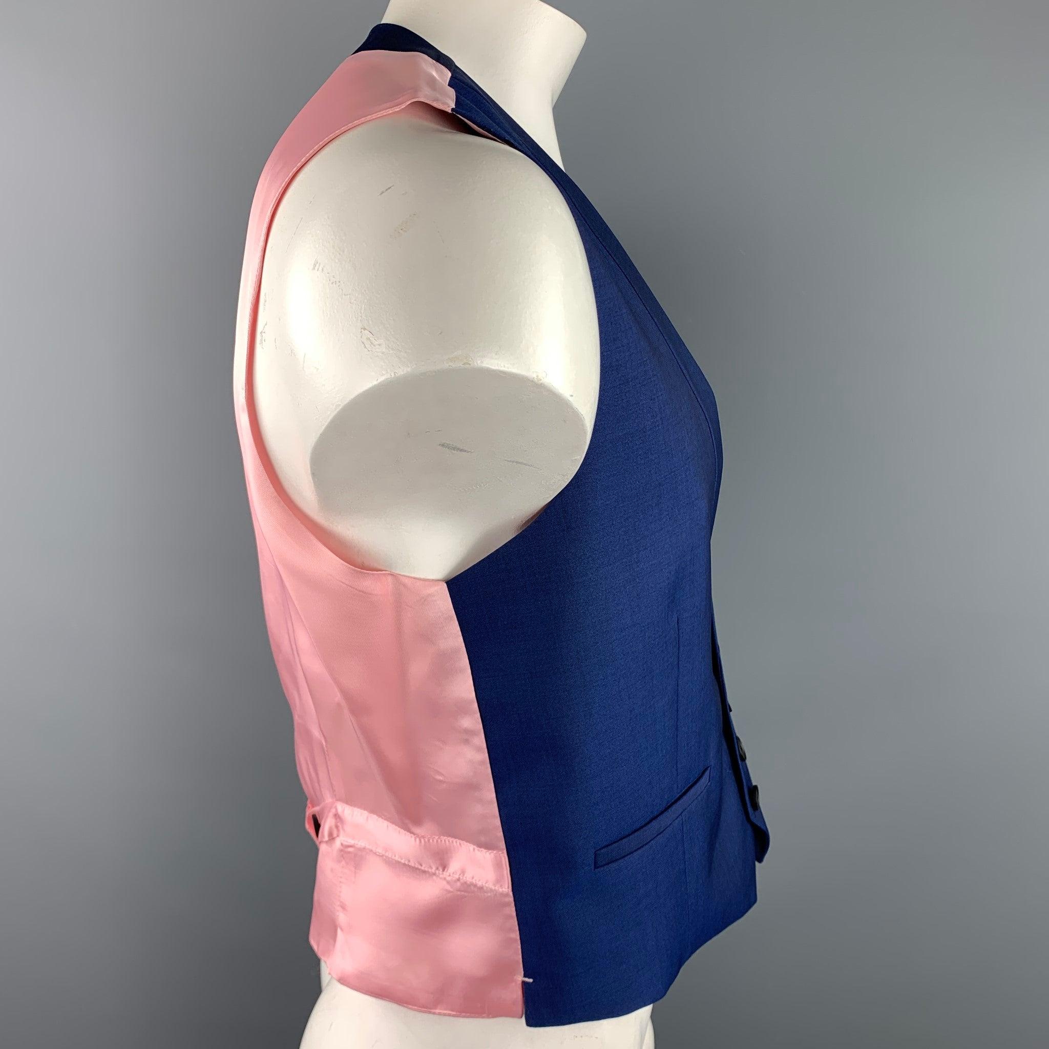PAUL SMITH vest comes in a navy wool with a pink back design featuring a shawl collar, slit pockets, and a buttoned closure. Made in Italy.Excellent
Pre-Owned Condition. 

Marked:   R 42 

Measurements: 
 
Shoulder: 14 inches 
Chest: 40 inches