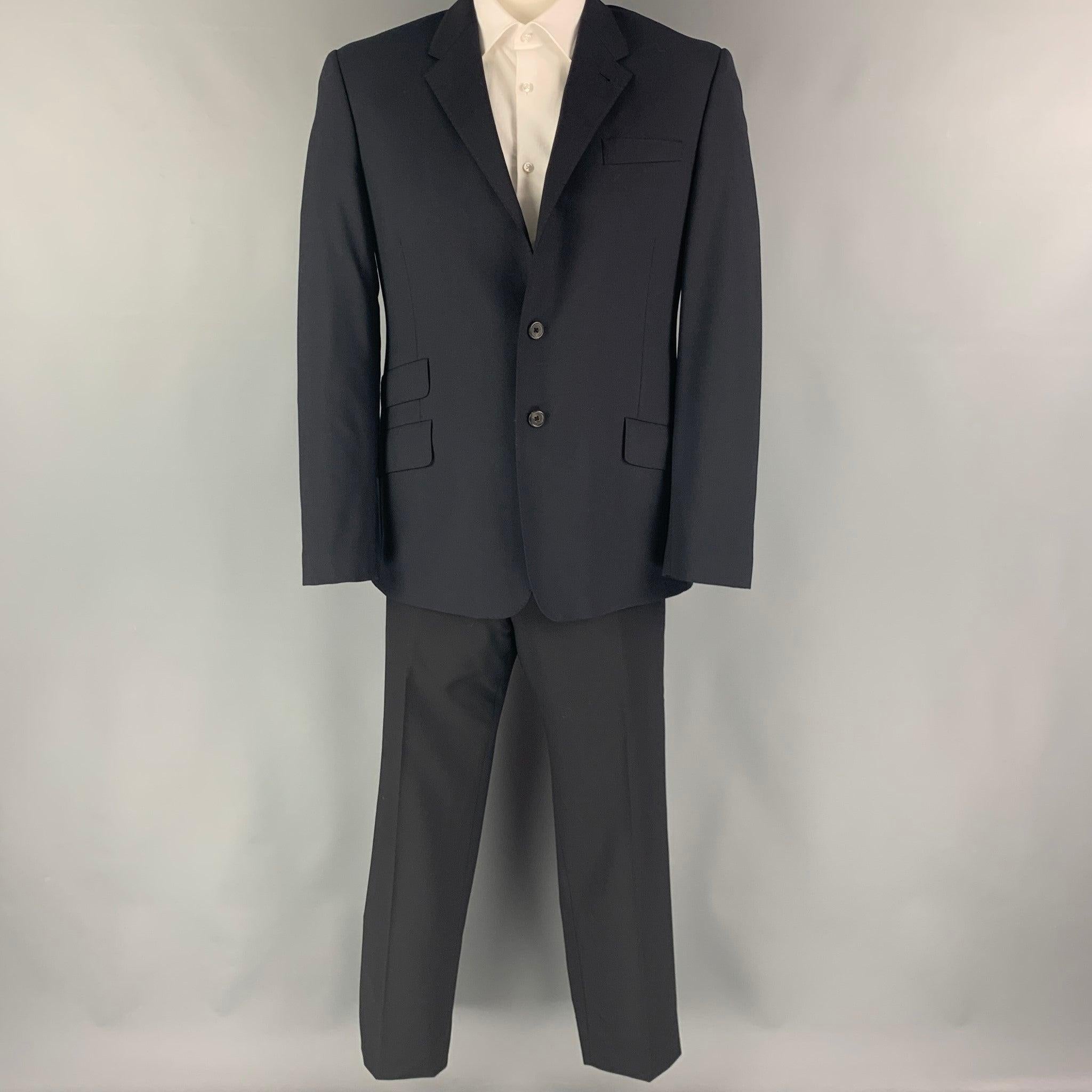 PAUL SMITH
suit comes in black wool with a full liner and includes a single breasted, double button sport coat with a notch lapel and matching flat front trousers. Excellent Pre-Owned Condition. 

Marked:   R 42  

Measurements: 
  -JacketShoulder: