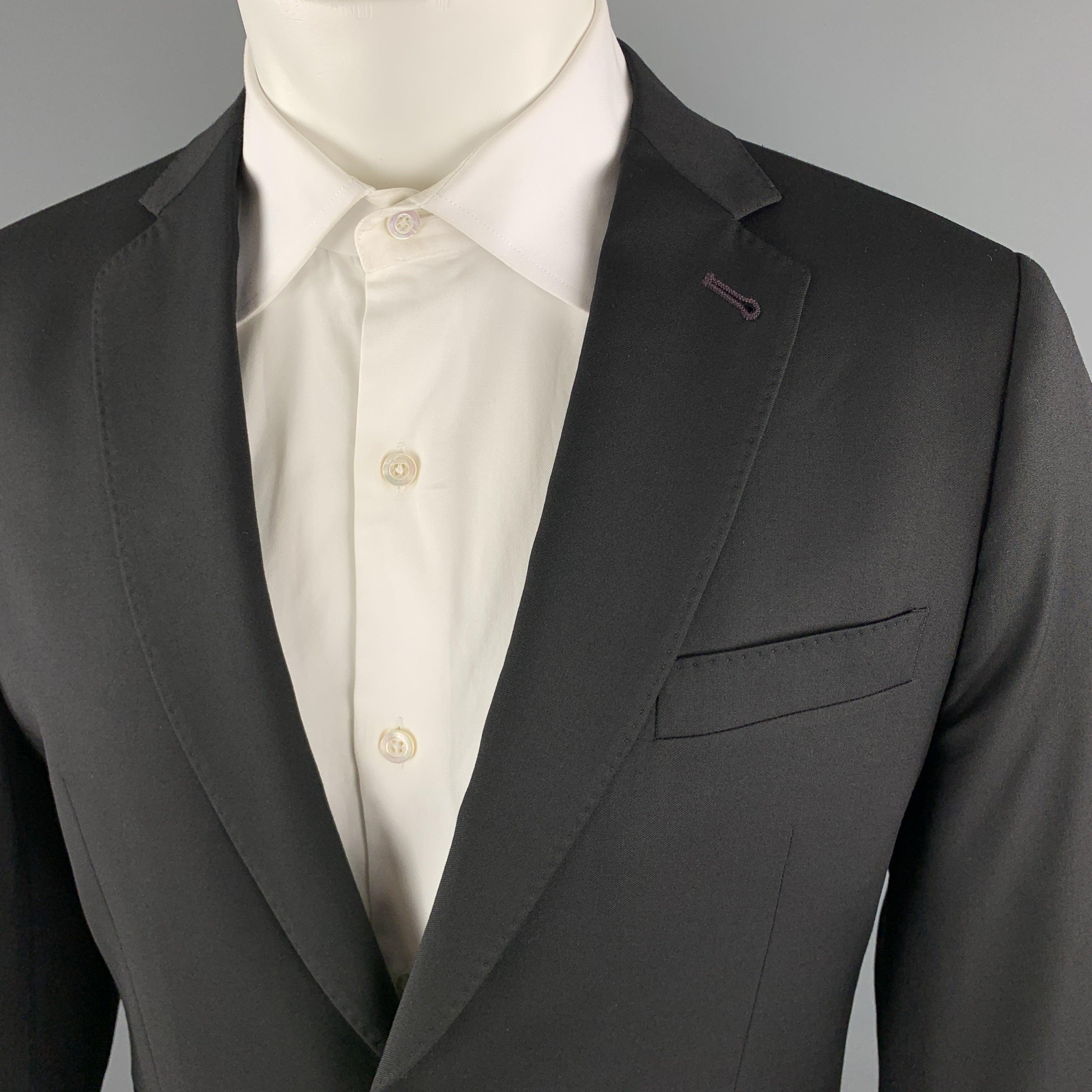 PAUL SMITH
sport coat comes in black wool twill with a top stitch notch lapel, single breasted, two button front, functional button cuffs, and purple contrast button holes. Made in Italy.Excellent Pre-Owned Condition. 

Marked:   42 

Measurements: