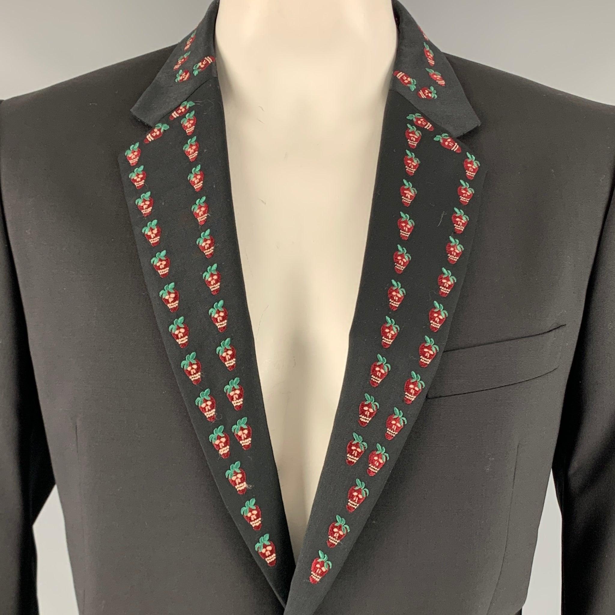 PAUL SMITH tuxedo sport coat
in a black wool blend featuring strawberry skull embroidery on notch lapel, double vented back, and single button closure. Made in Italy.Very Good Pre-Owned Condition. Minor signs of wear. 

Marked:   44R 

Measurements: