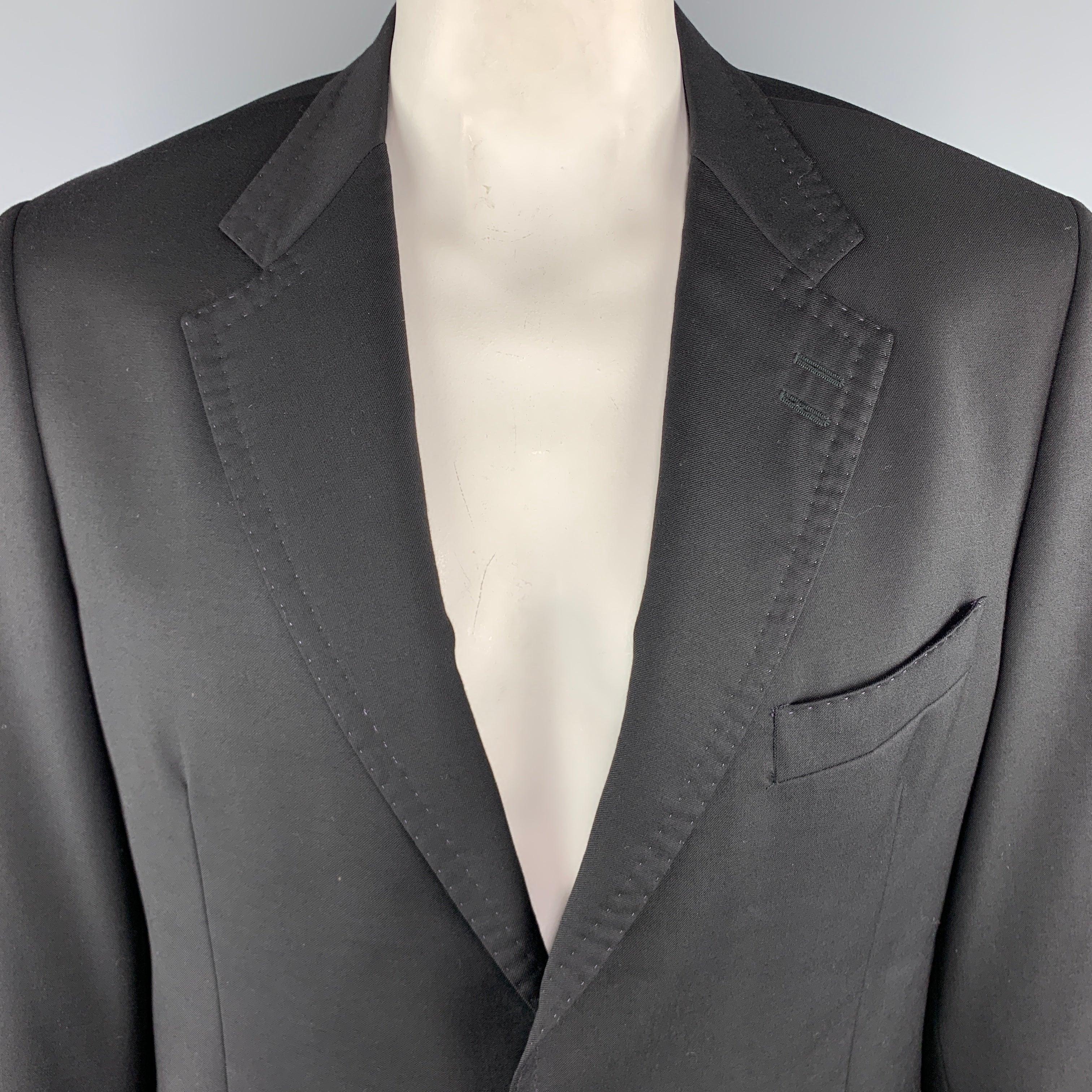 PAUL SMITH
Sport Coat comes in a black tone in a solid wool / cashmere material, with a notch lapel, slit and patch pockets, stitches finishing throughout, silver tone metal buttons, two buttons at closure, single breasted, buttoned cuffs, and a