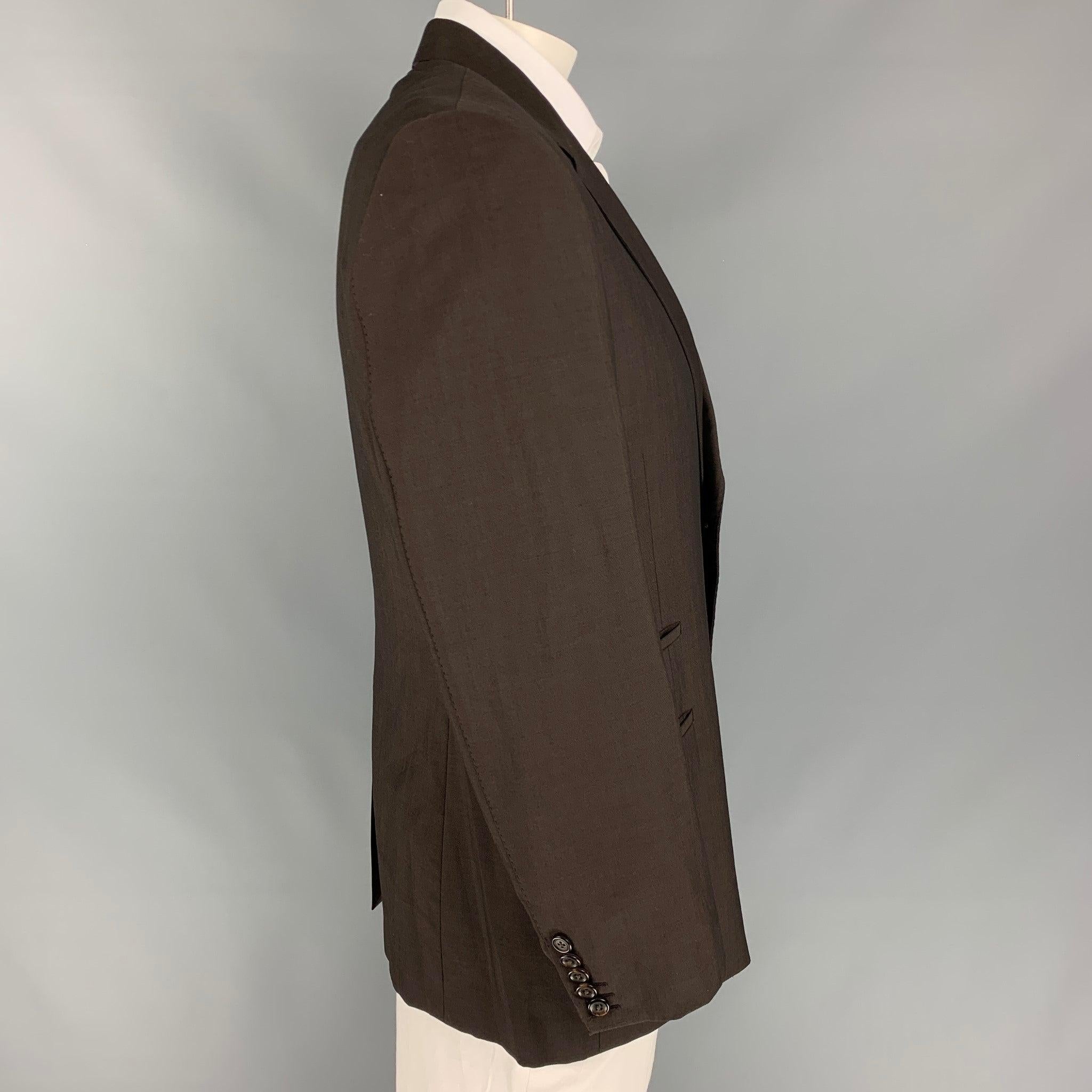 PAUL SMITH
sport coat comes in a brown wool / mohair wih a full liner featuring a notch lapel, front pockets, and a double button closure. Made in Italy.
Very Good
Pre-Owned Condition.  

Marked:   44 

Measurements: 
 
Shoulder: 19 inches Chest: 44