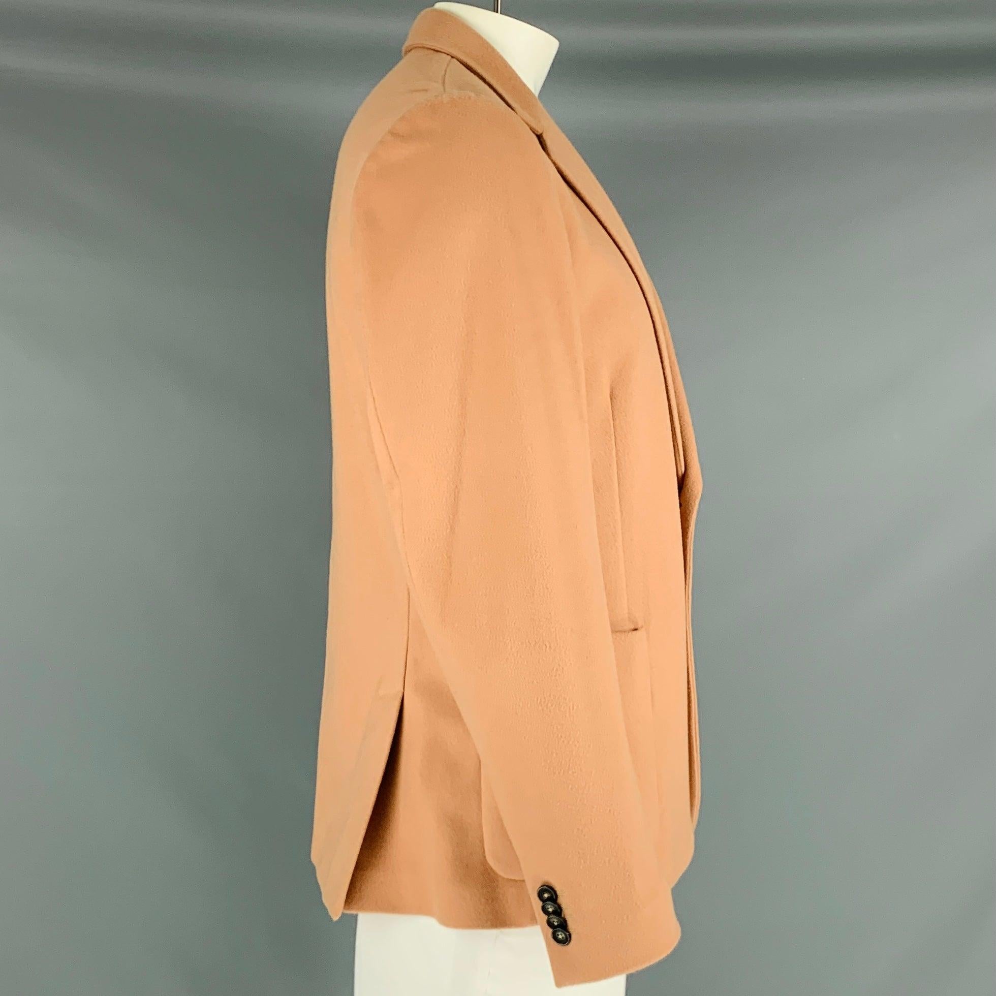 PAUL SMITH sport coat
in a rose wool cashmere blend fabric featuring notch lapel, double vented back, and double button closure. Made in Italy.Very Good Pre-Owned Condition.
Moderate signs of wear. 

Marked:   44 

Measurements: 
 
Shoulder: 17